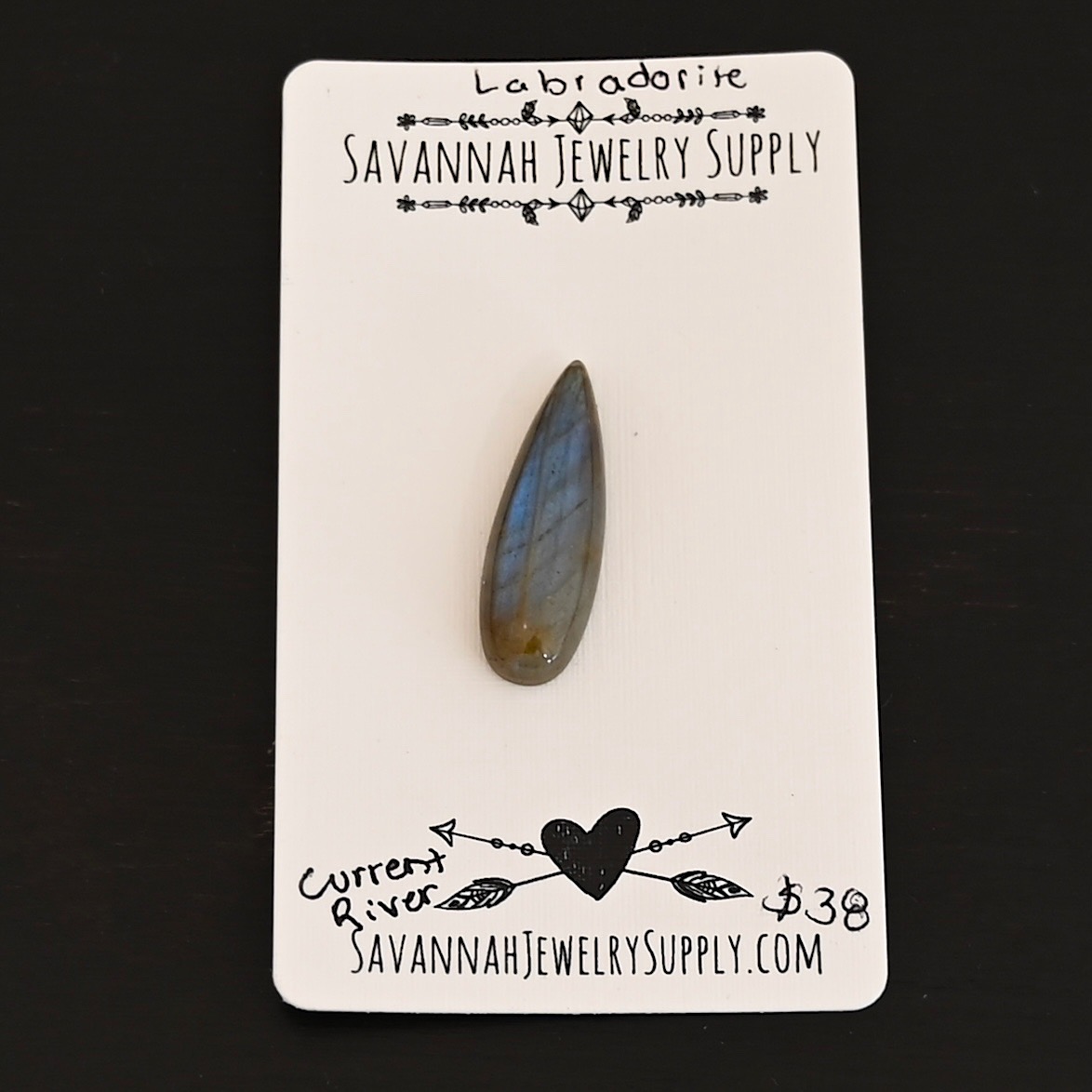Current River Labradorite Cabochon Parcel shown on business card