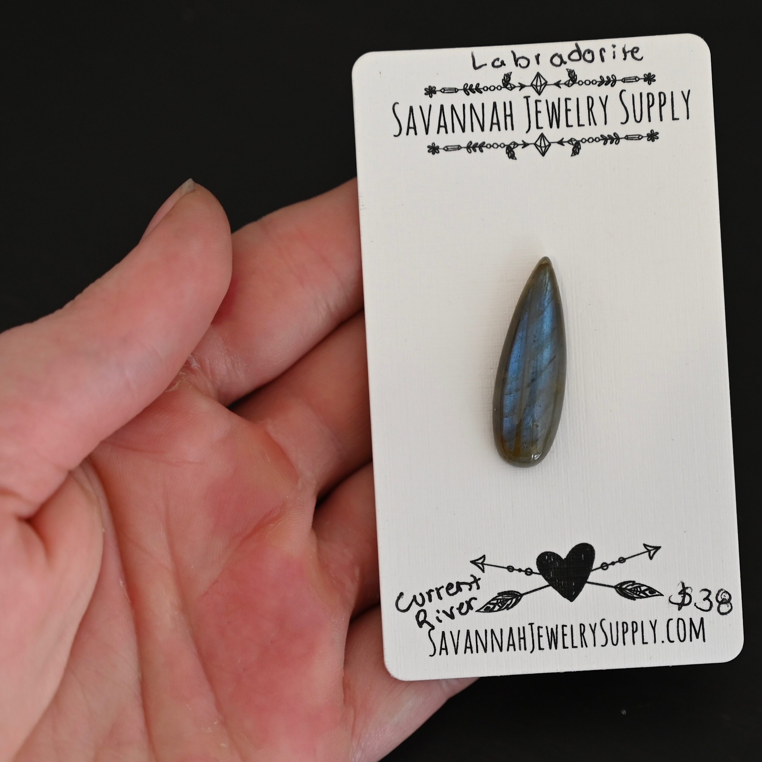 Current River Labradorite Cabochon Parcel shown in hand