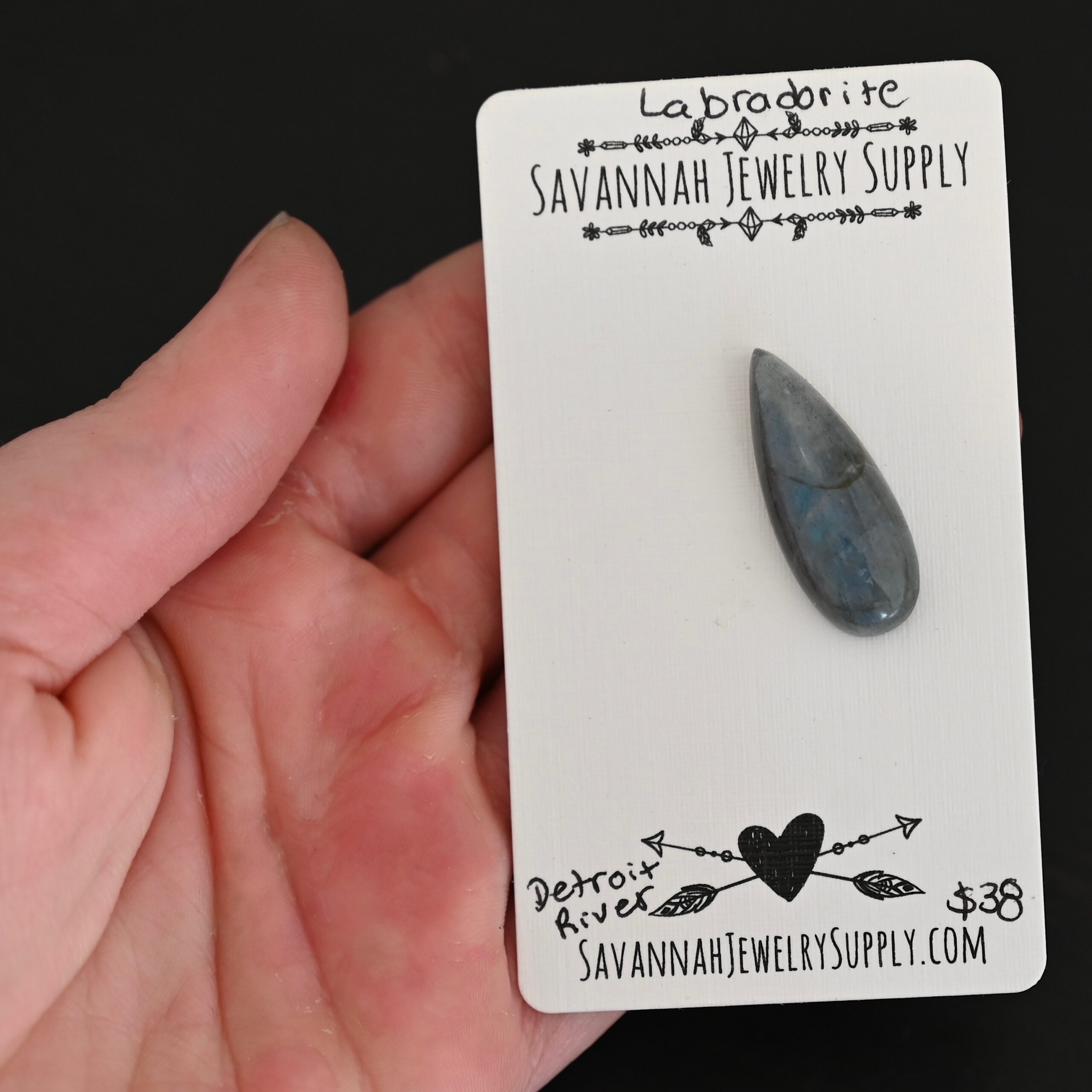 Detroit River Labradorite Cabochon Parcel shown in hand