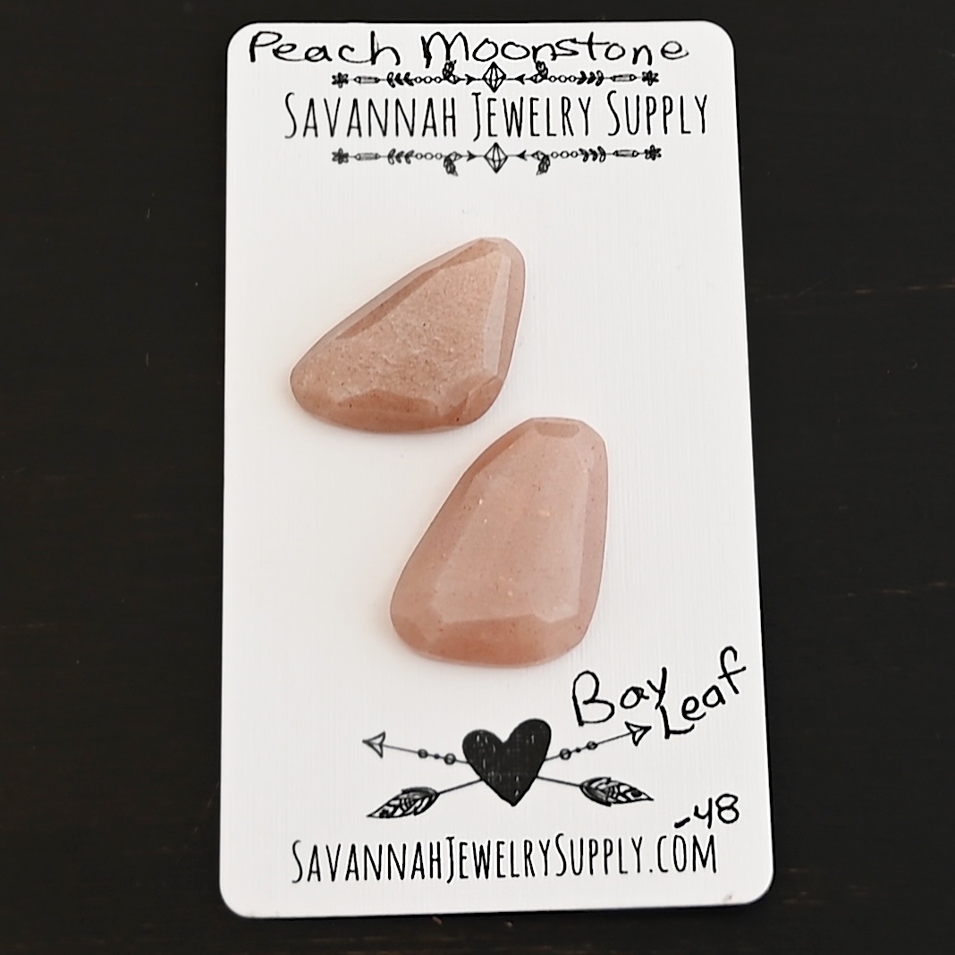 Bay Leaf Rose Cut Peach Moonstone Cabochon Parcel shown on business card