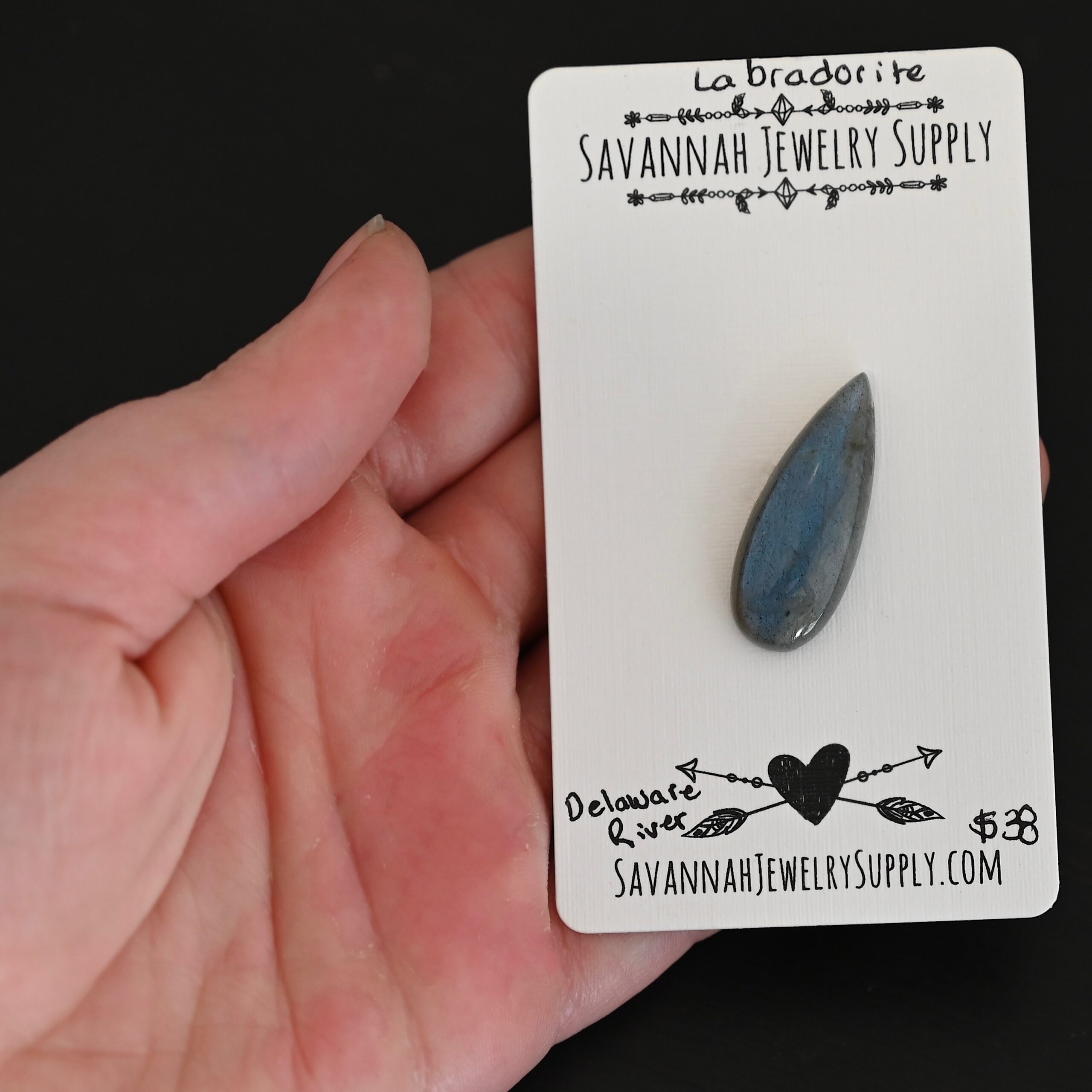 Delaware River Labradorite Cabochon Parcel shown in hand