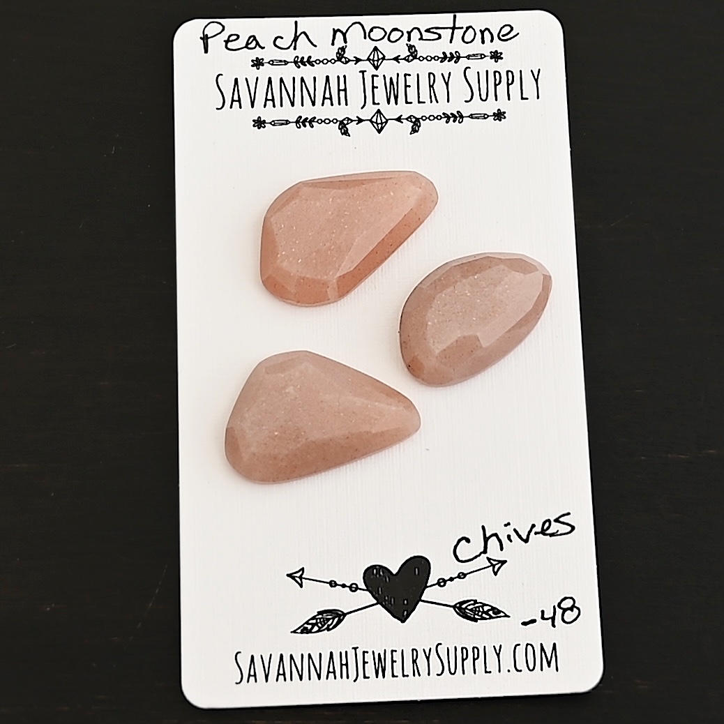 Chives Rose Cut Peach Moonstone Cabochon Parcel shown on business card