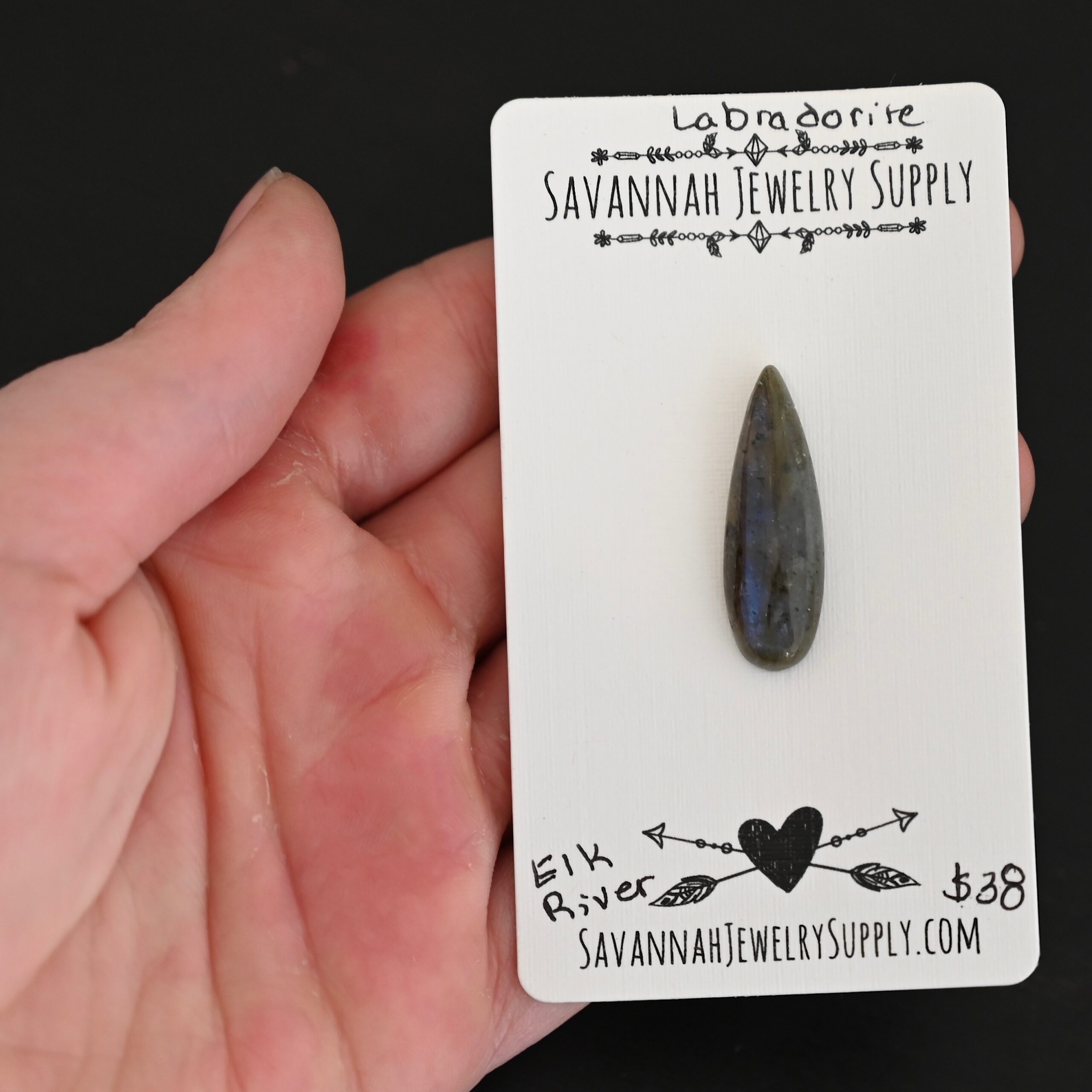 Elk River Labradorite Cabochon Parcel shown in hand