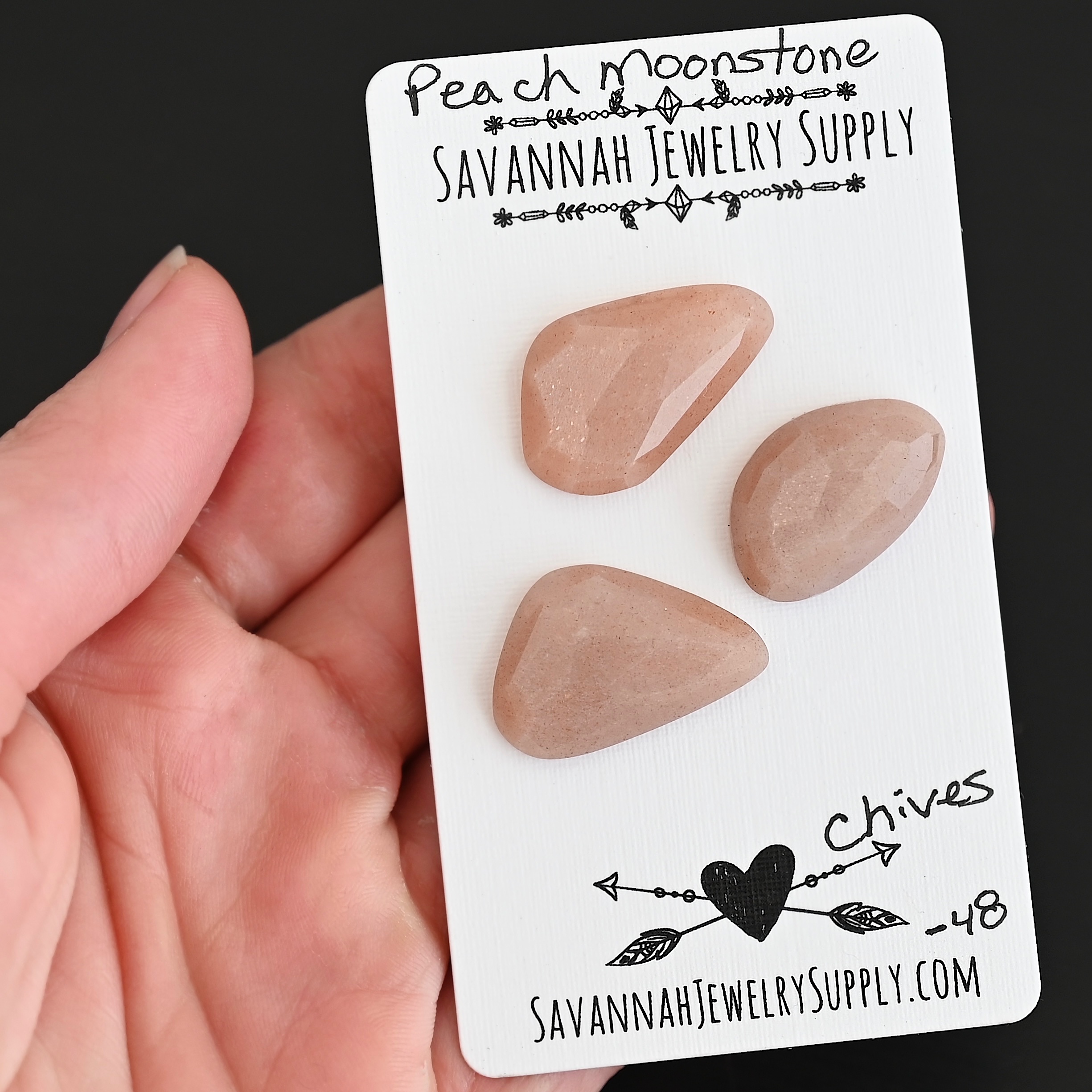 Chives Rose Cut Peach Moonstone Cabochon Parcel shown in hand