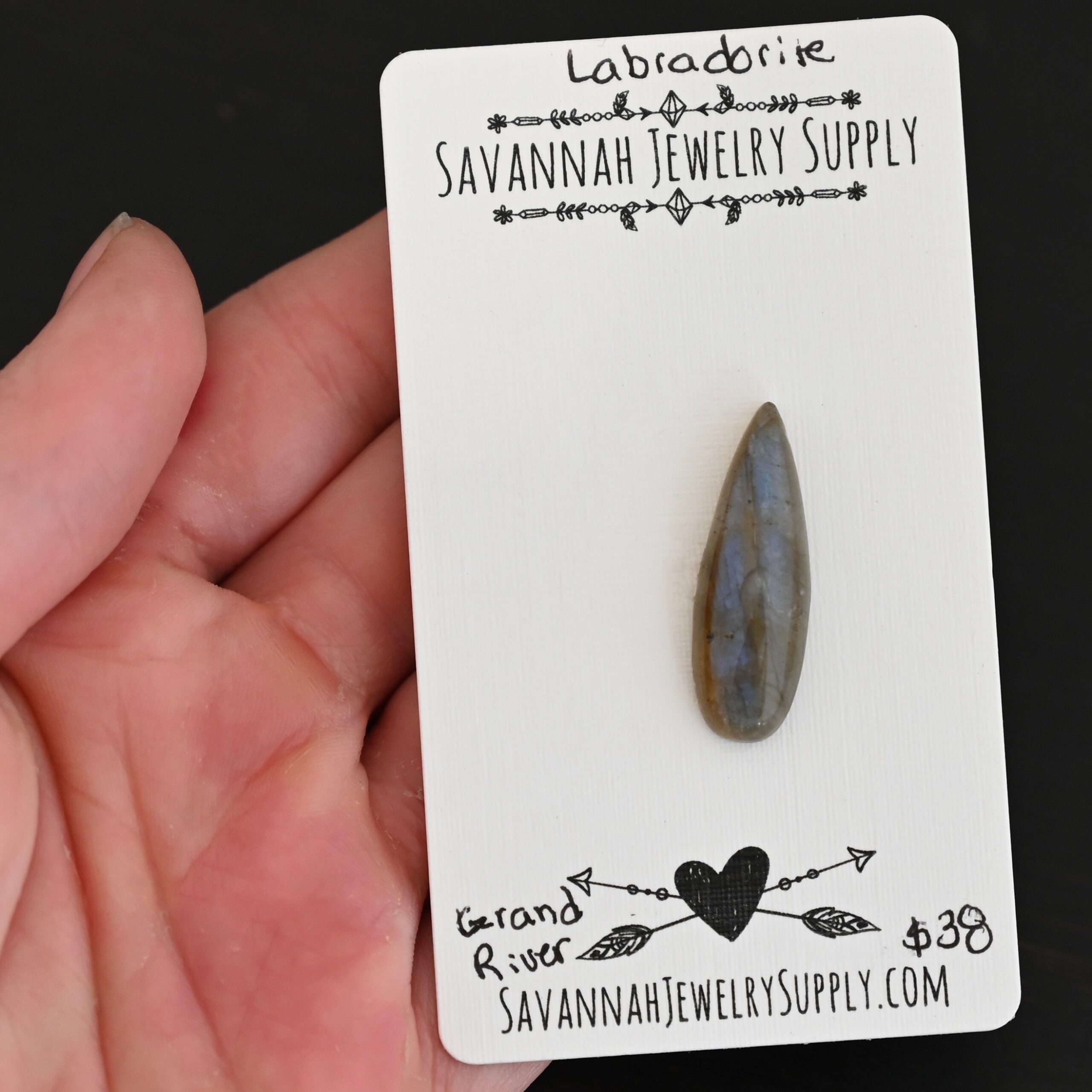 Grand River Labradorite Cabochon Parcel shown in hand
