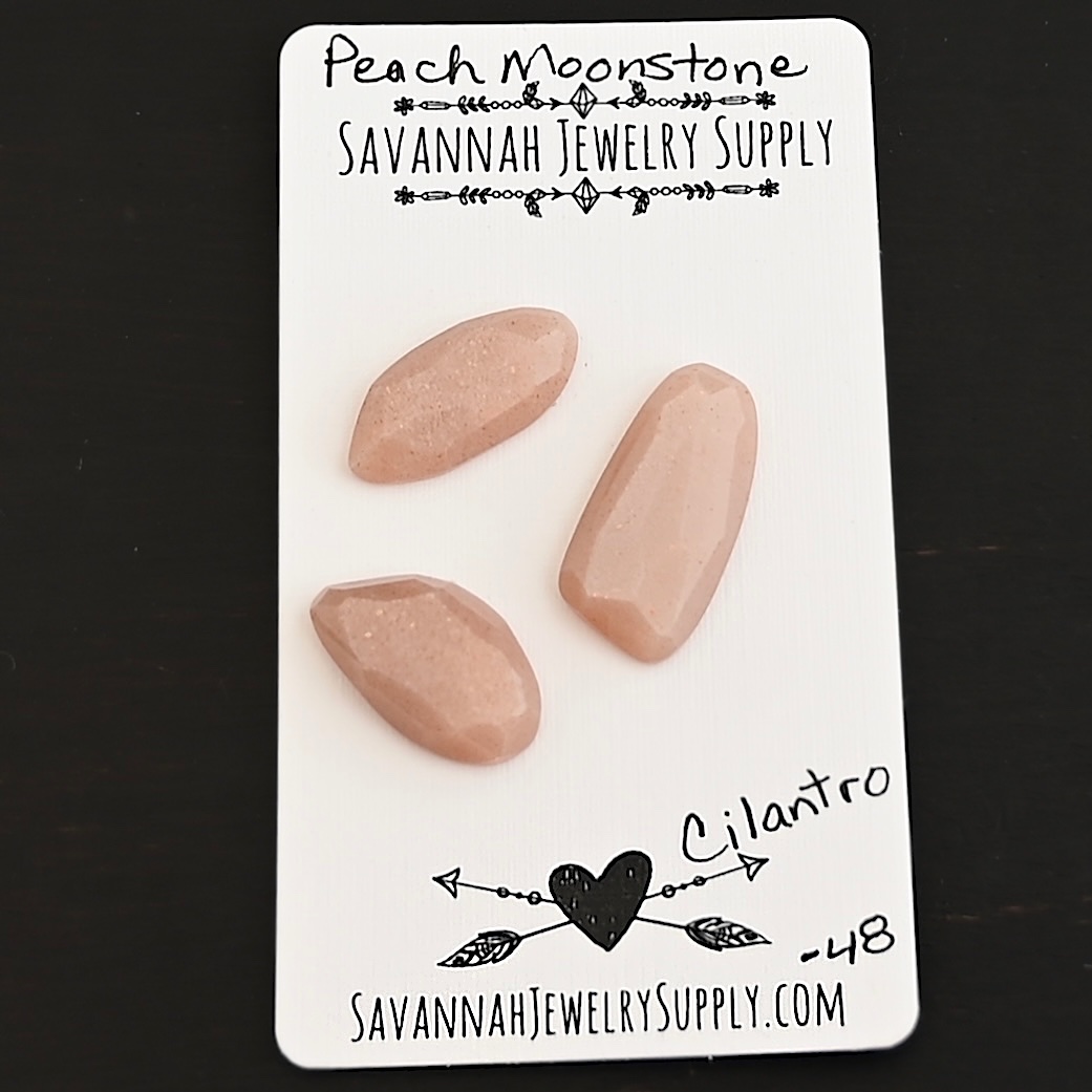 Cilantro Rose Cut Peach Moonstone Cabochon Parcel shown on business card