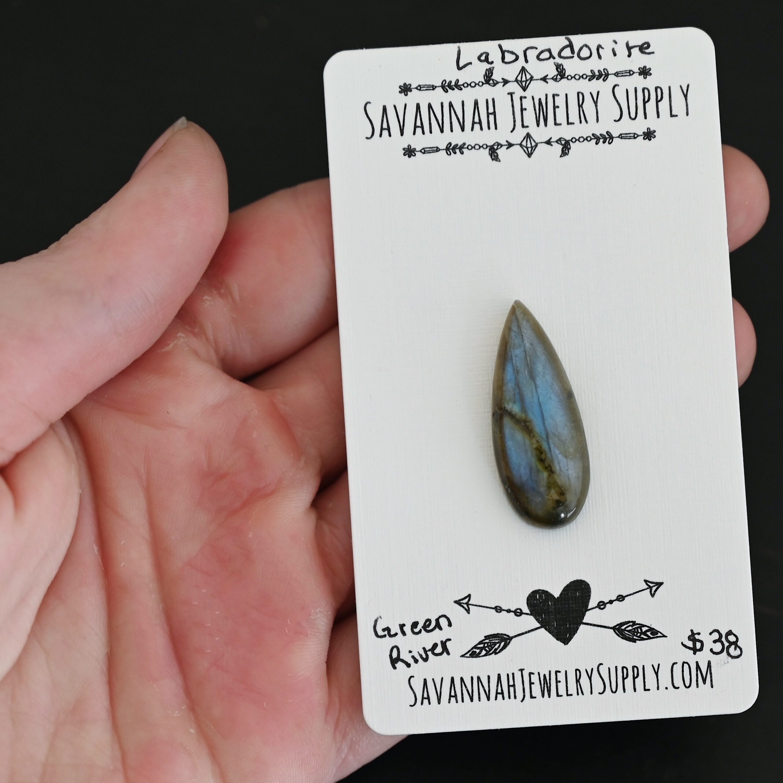 Green River Labradorite Cabochon Parcel shown in hand