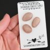 Dill Rose Cut Peach Moonstone Cabochon Parcel shown in hand