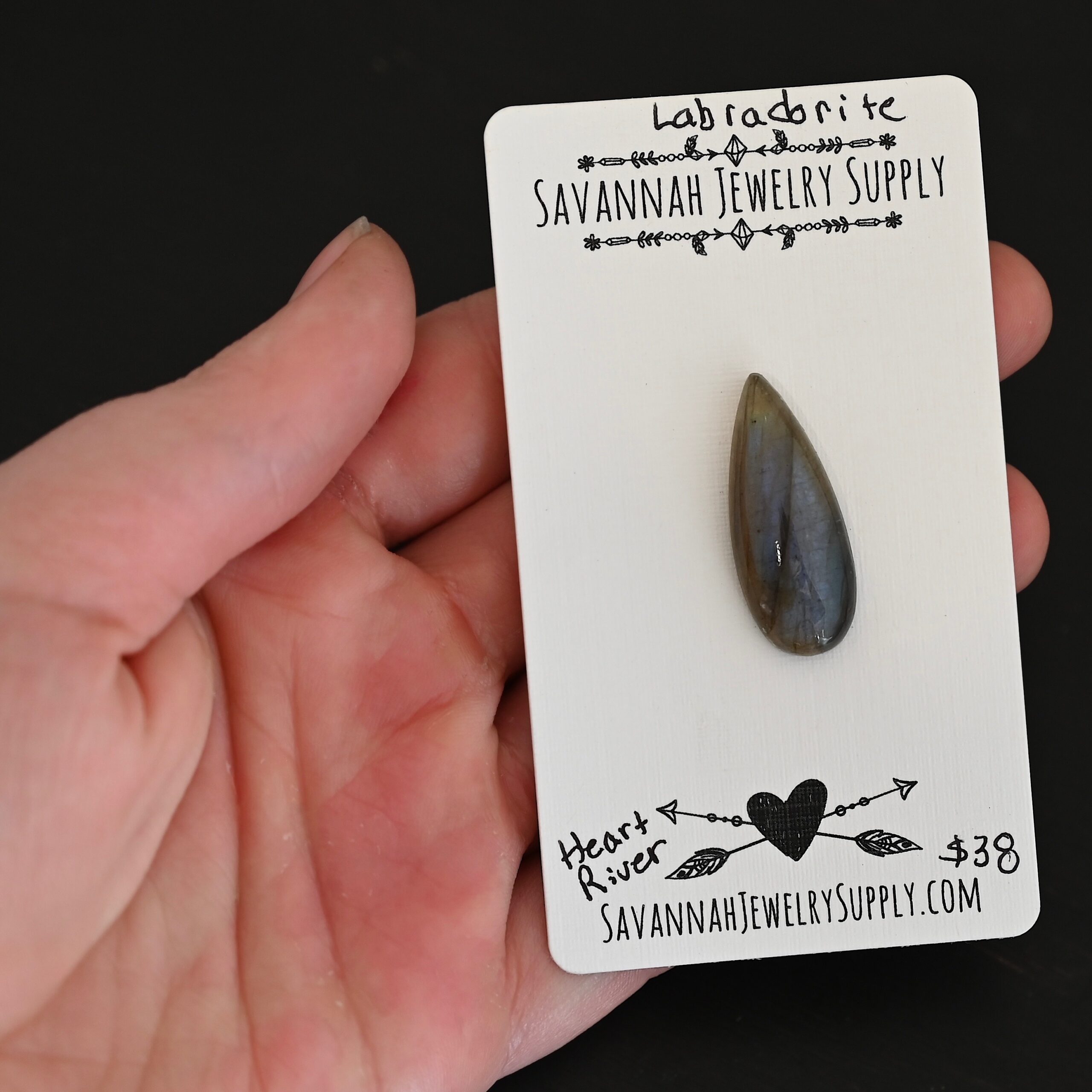 Heart River Labradorite Cabochon Parcel shown in hand