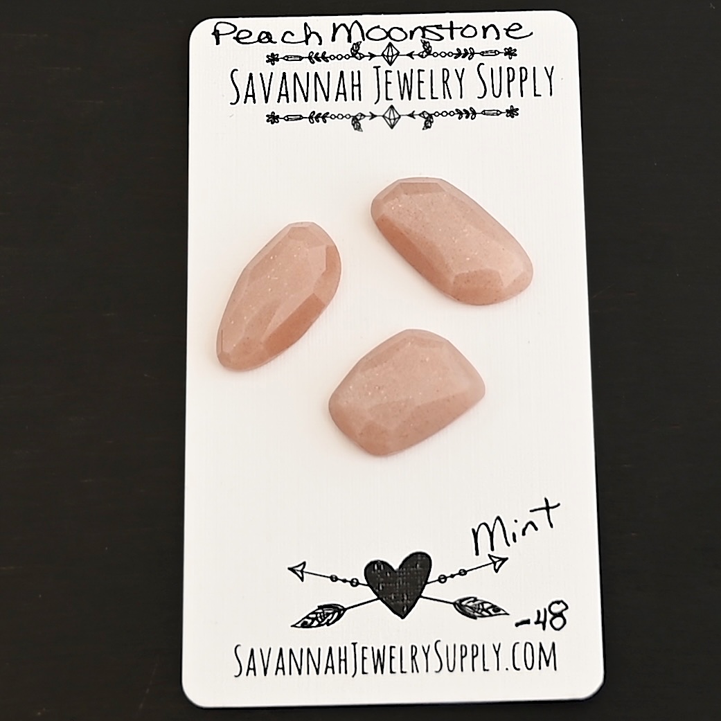 Mint Rose Cut Peach Moonstone Cabochon Parcel shown on business card