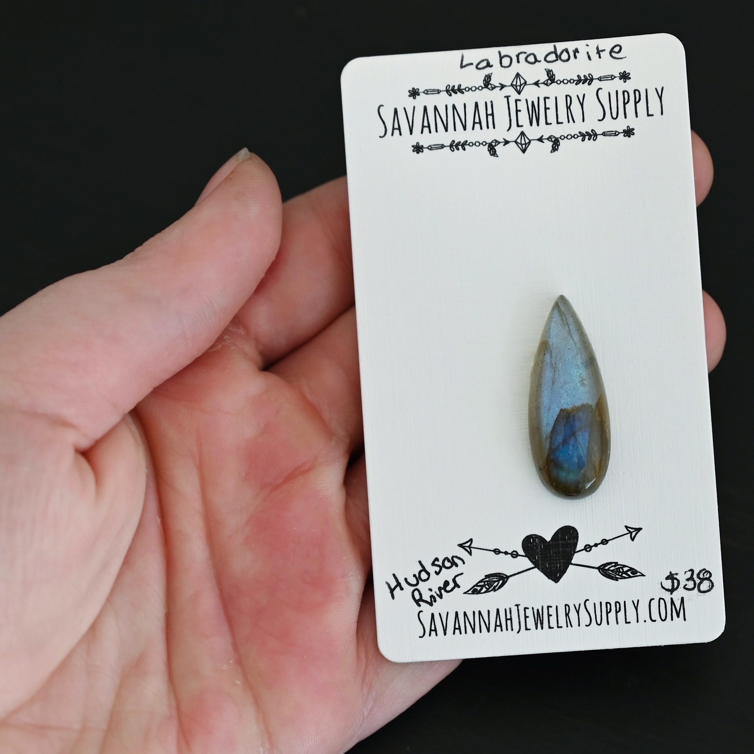 Hudson River Labradorite Cabochon Parcel shown in hand