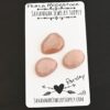Parsley Rose Cut Peach Moonstone Cabochon Parcel shown on business card