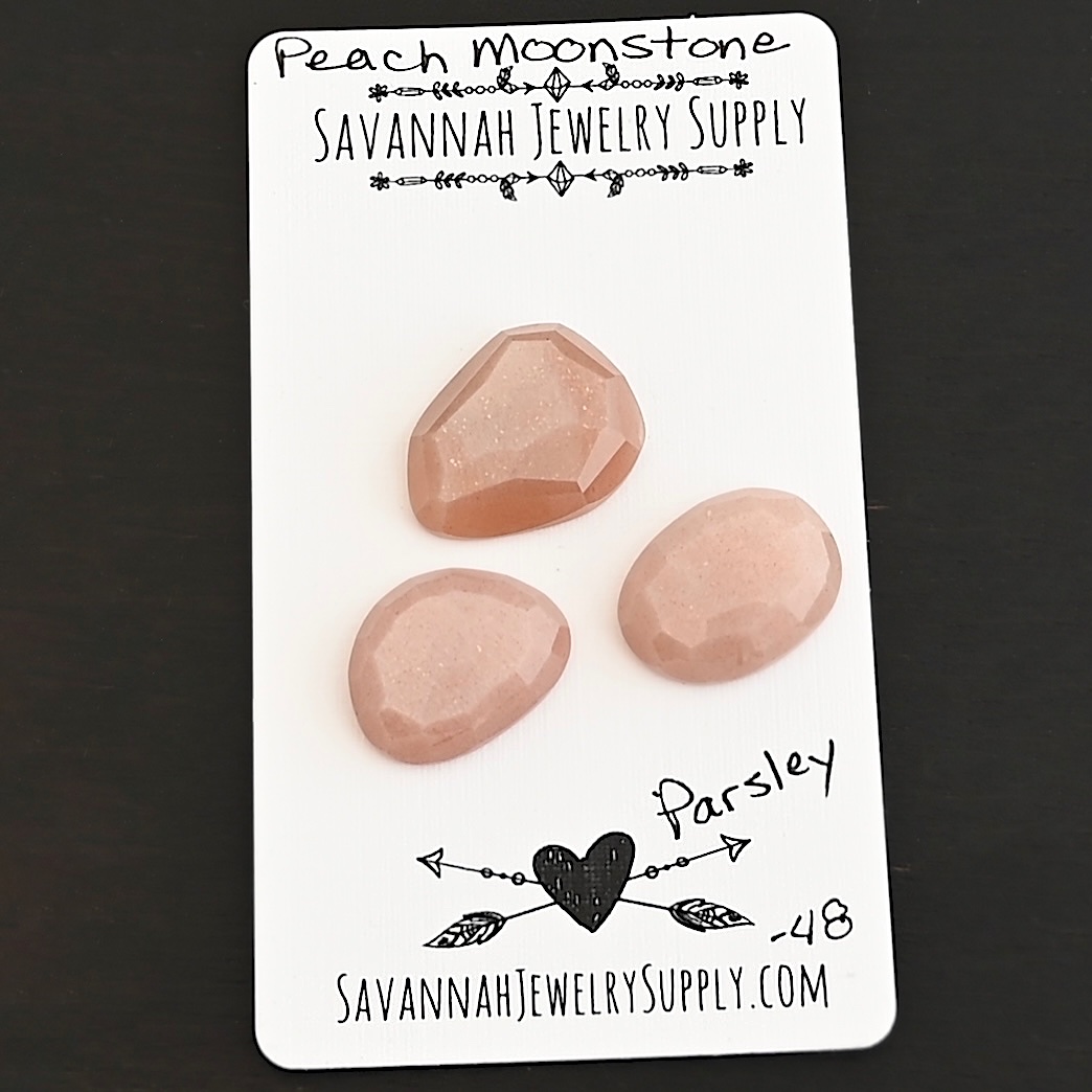 Parsley Rose Cut Peach Moonstone Cabochon Parcel shown on business card