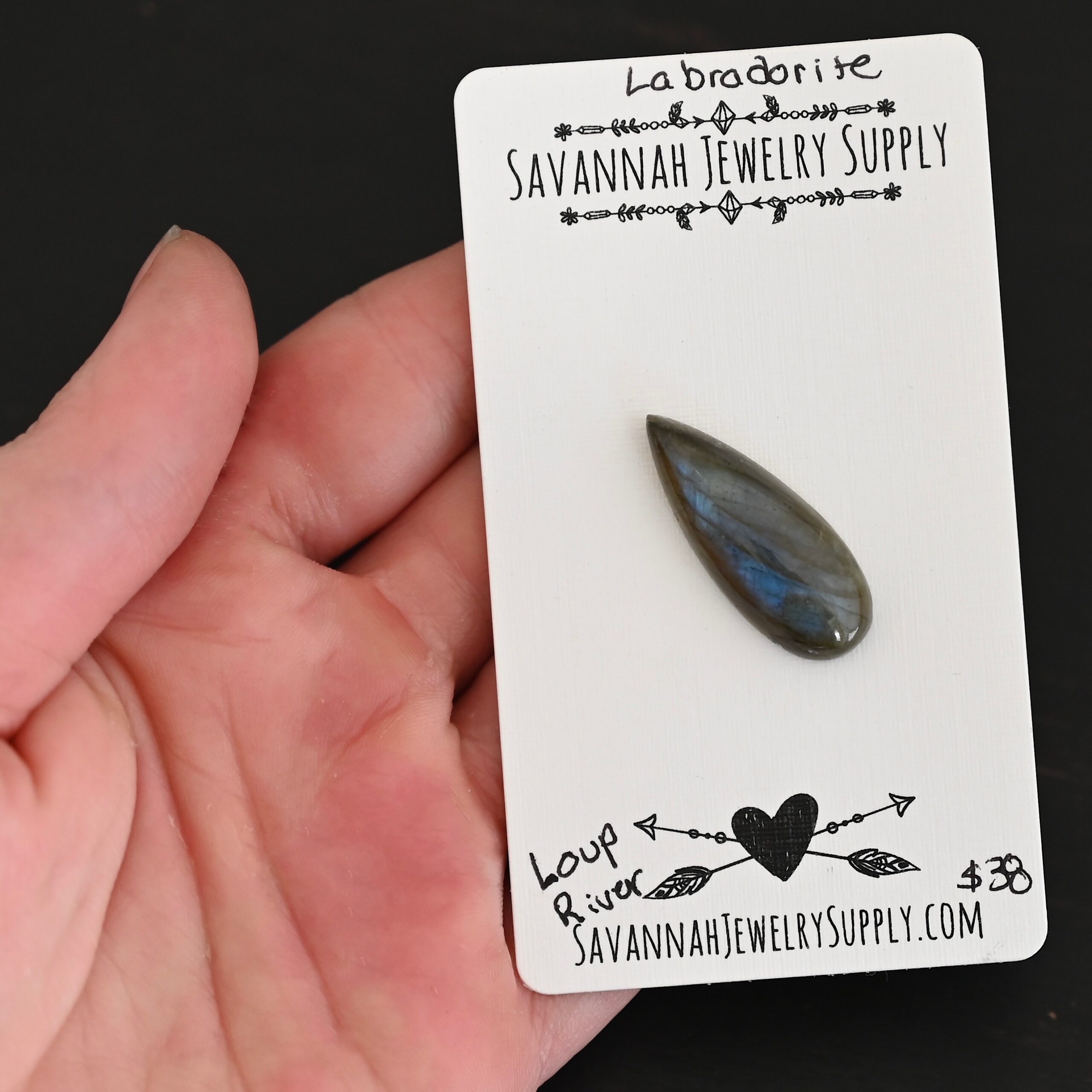 Loup River Labradorite Cabochon Parcel shown in hand
