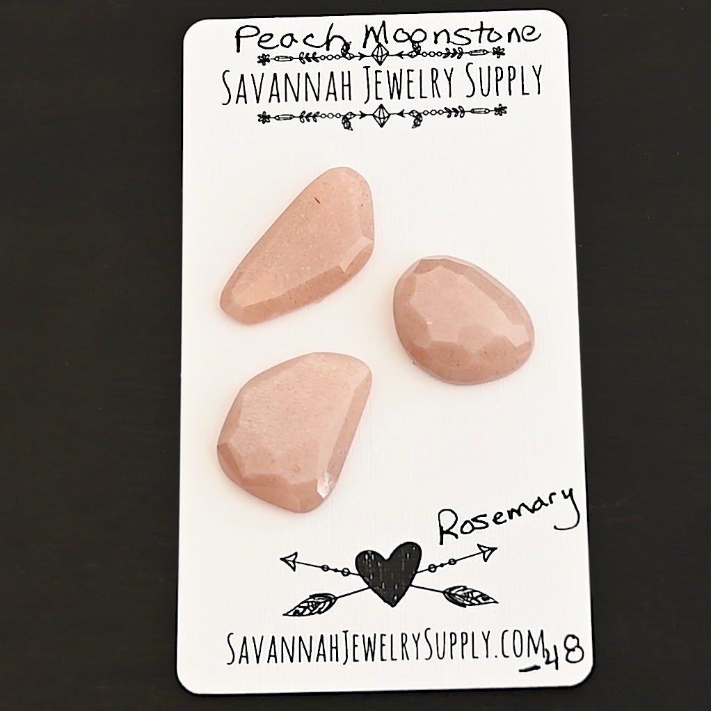 Rosemary Rose Cut Peach Moonstone Cabochon Parcel shown on business card