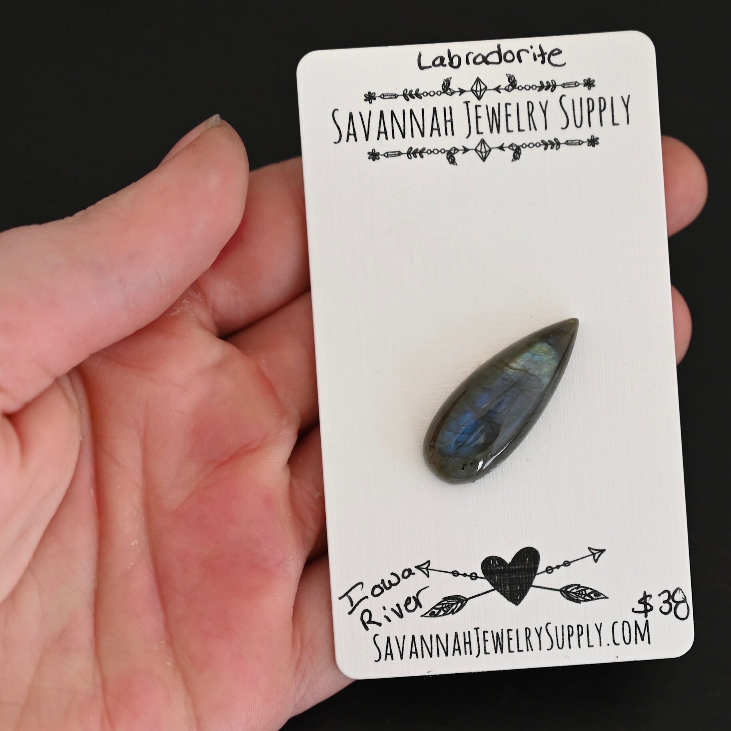 Iowa River Labradorite Cabochon Parcel shown in hand
