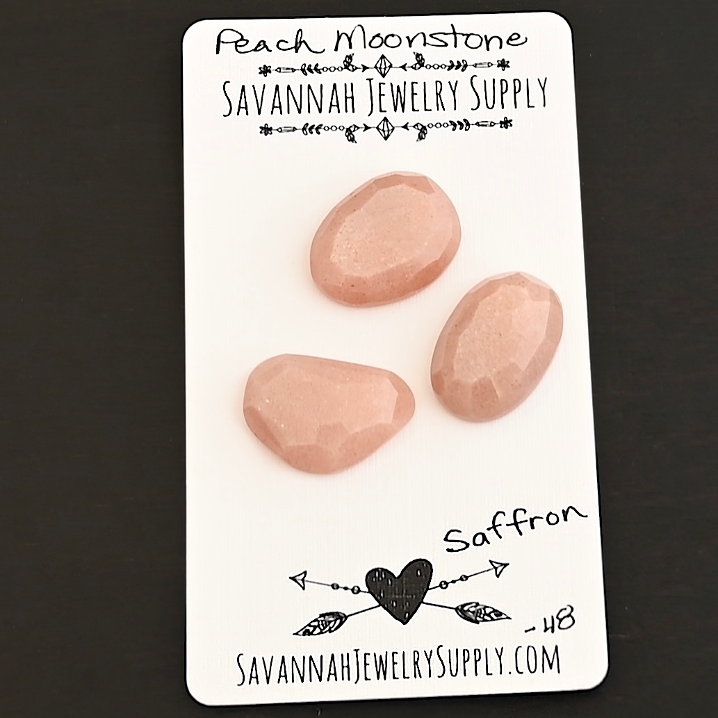 Saffron Rose Cut Peach Moonstone Cabochon Parcel shown on business card