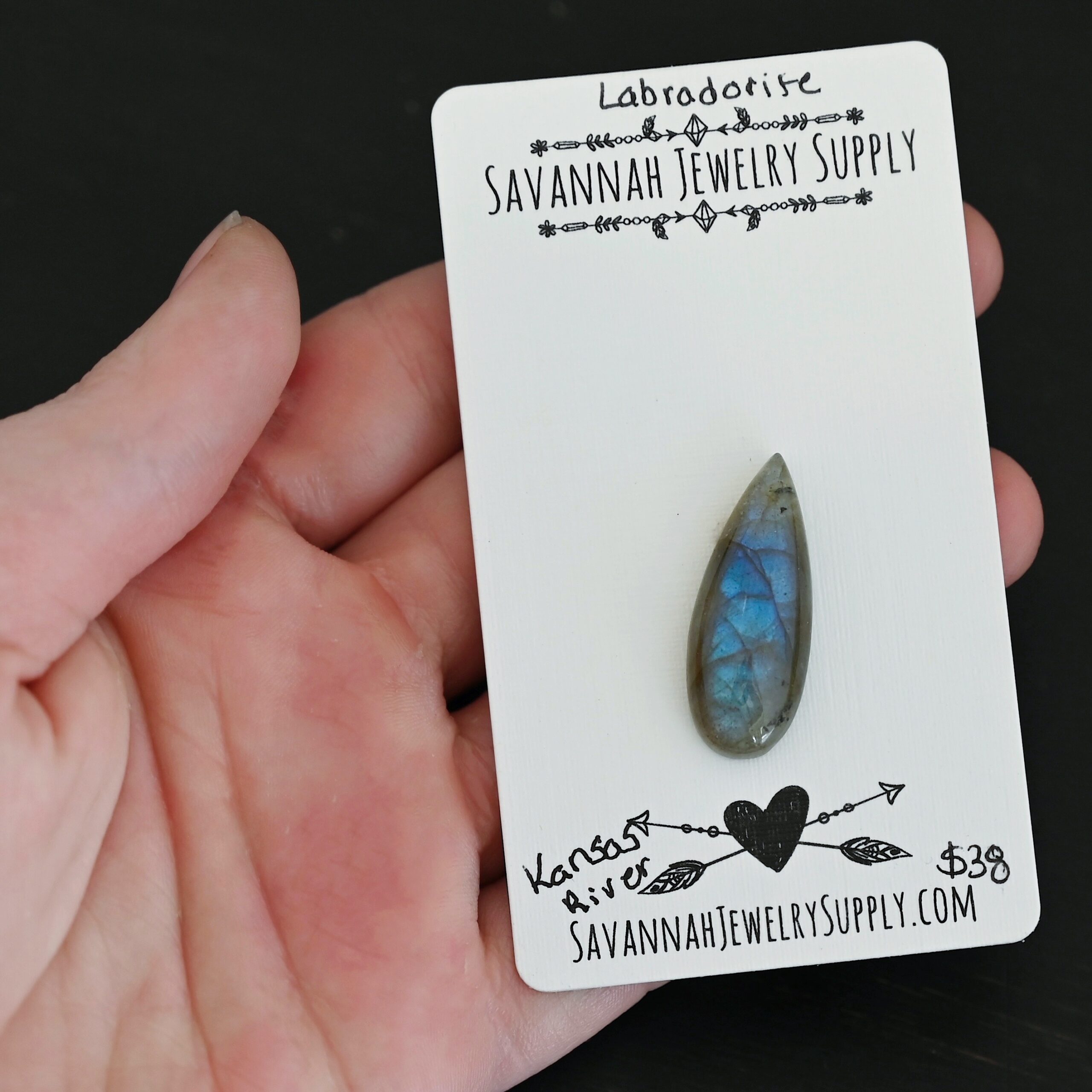 Kansas River Labradorite Cabochon Parcel shown in hand