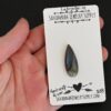 Kentucky River Labradorite Cabochon Parcel shown in hand