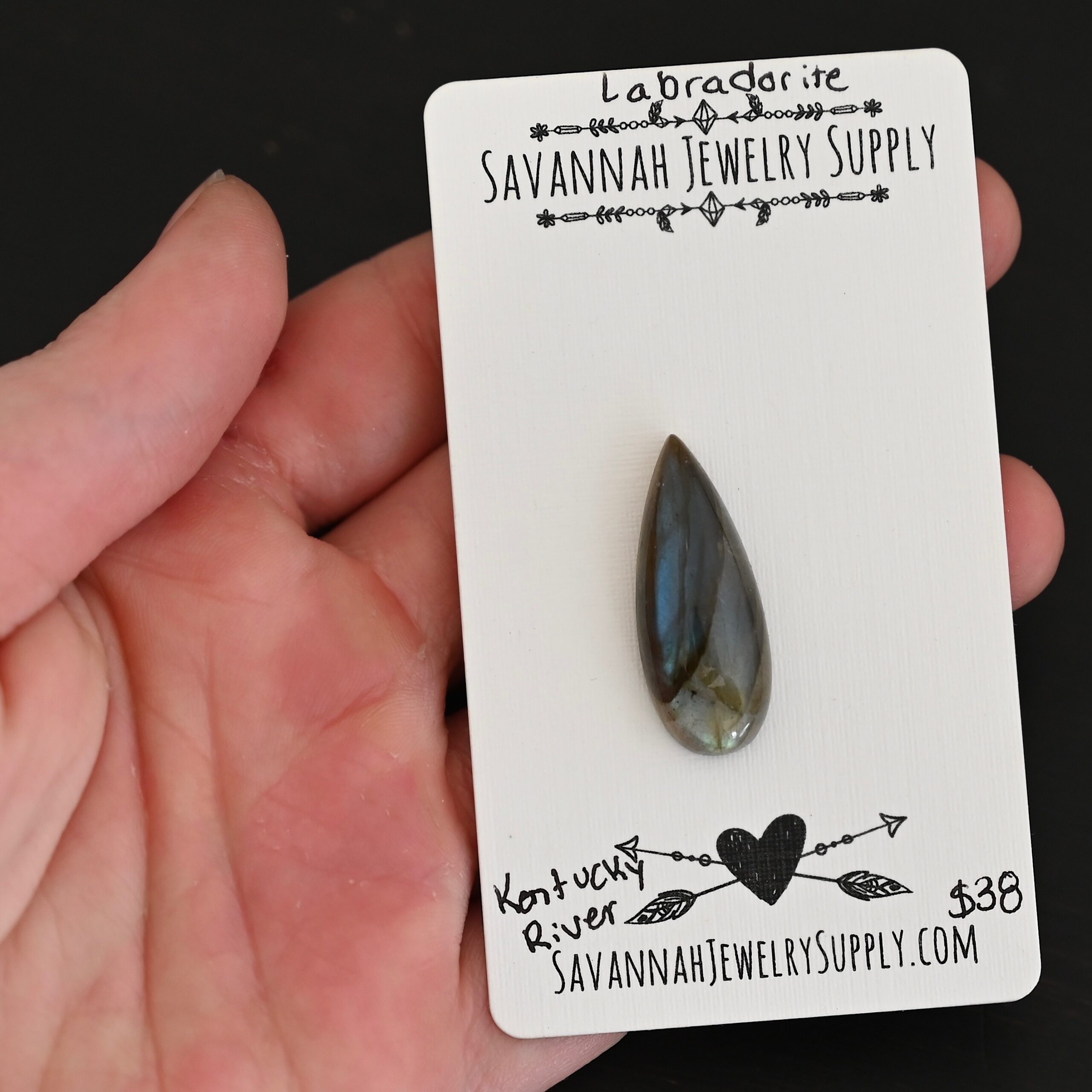 Kentucky River Labradorite Cabochon Parcel shown in hand