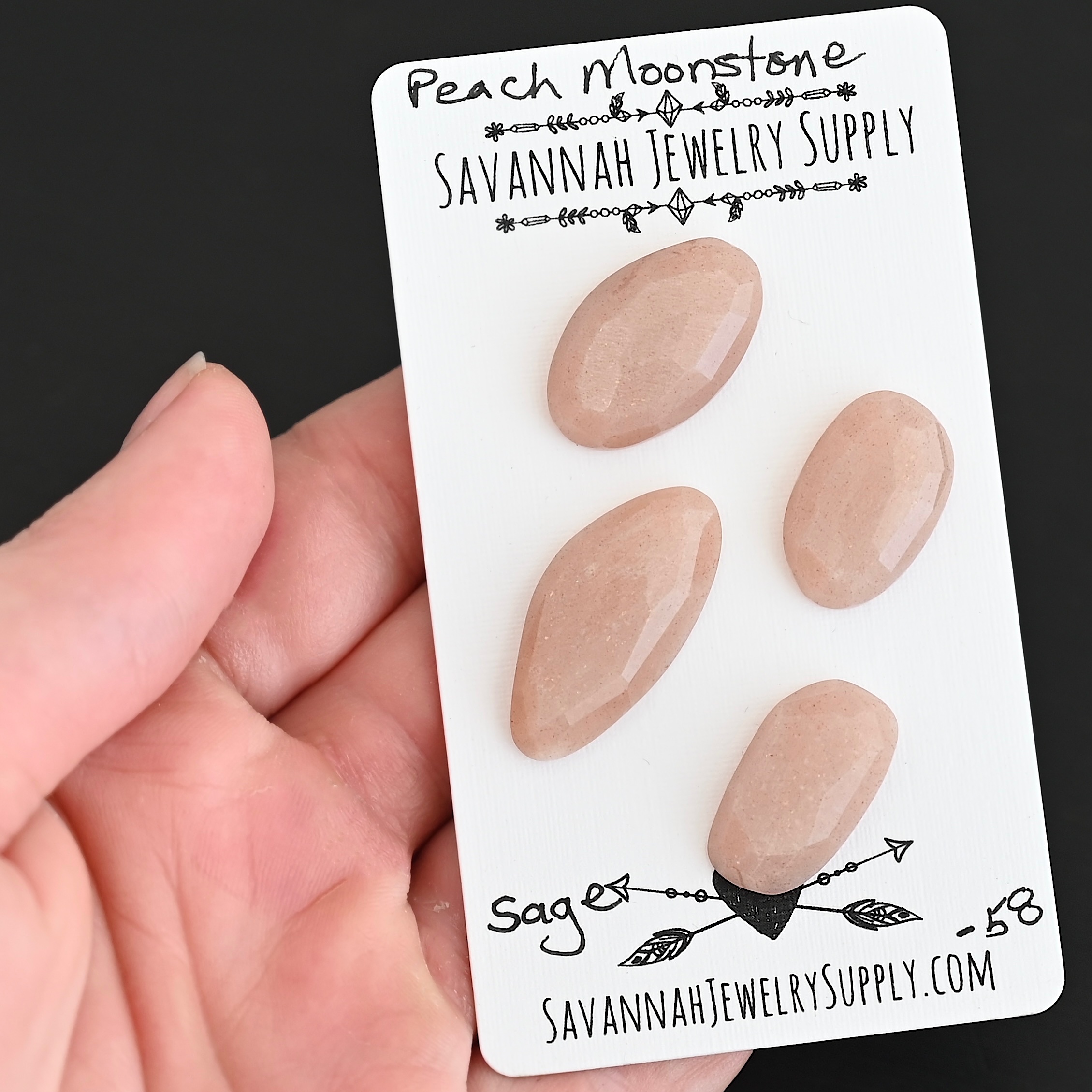Sage Rose Cut Peach Moonstone Cabochon Parcel shown in hand
