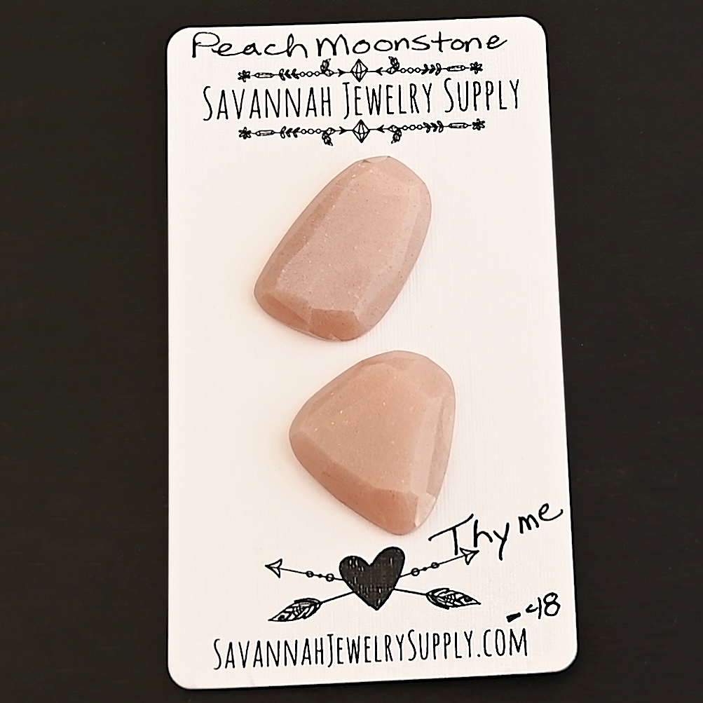 Thyme Rose Cut Peach Moonstone Cabochon Parcel shown on business card