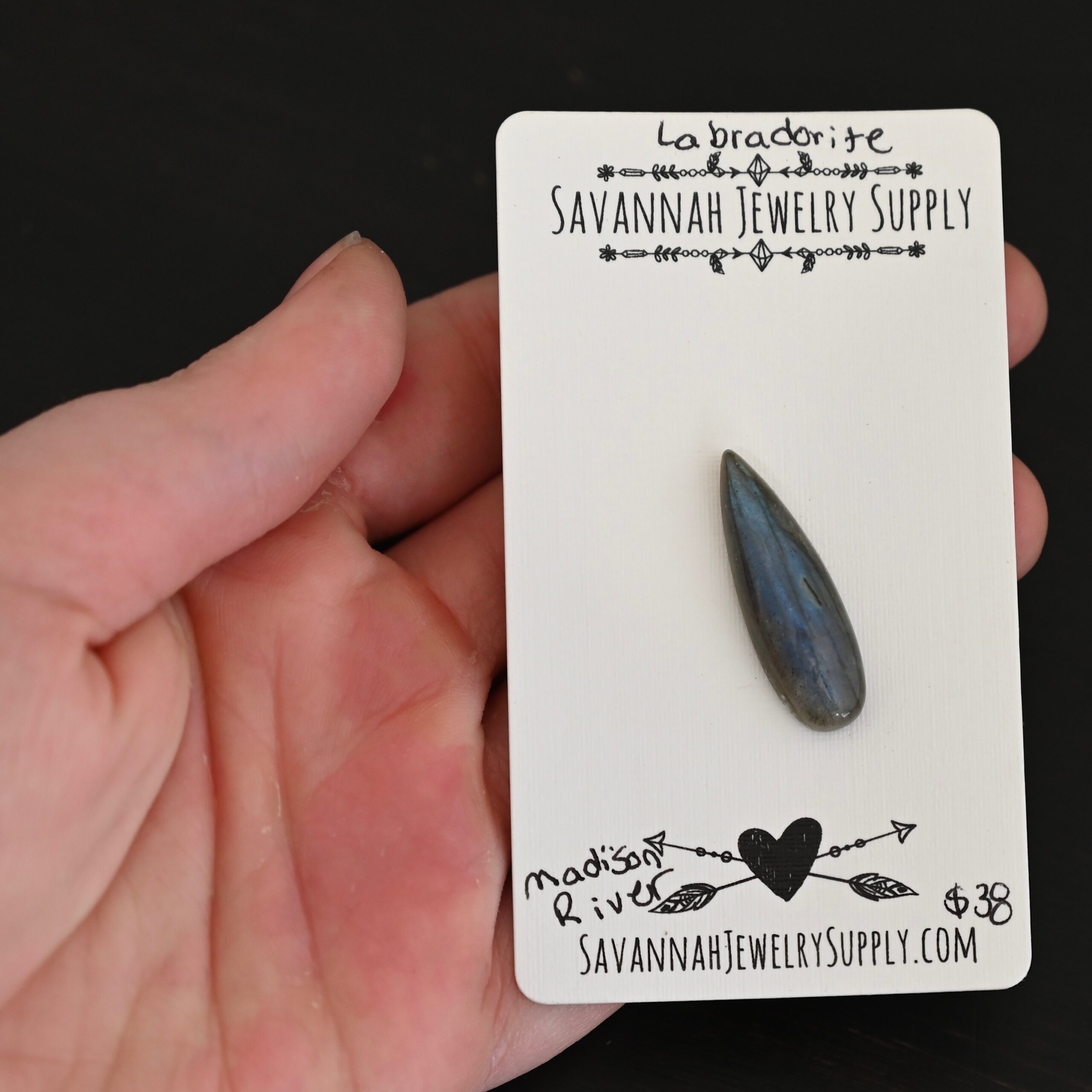 Madison River Labradorite Cabochon Parcel shown in hand