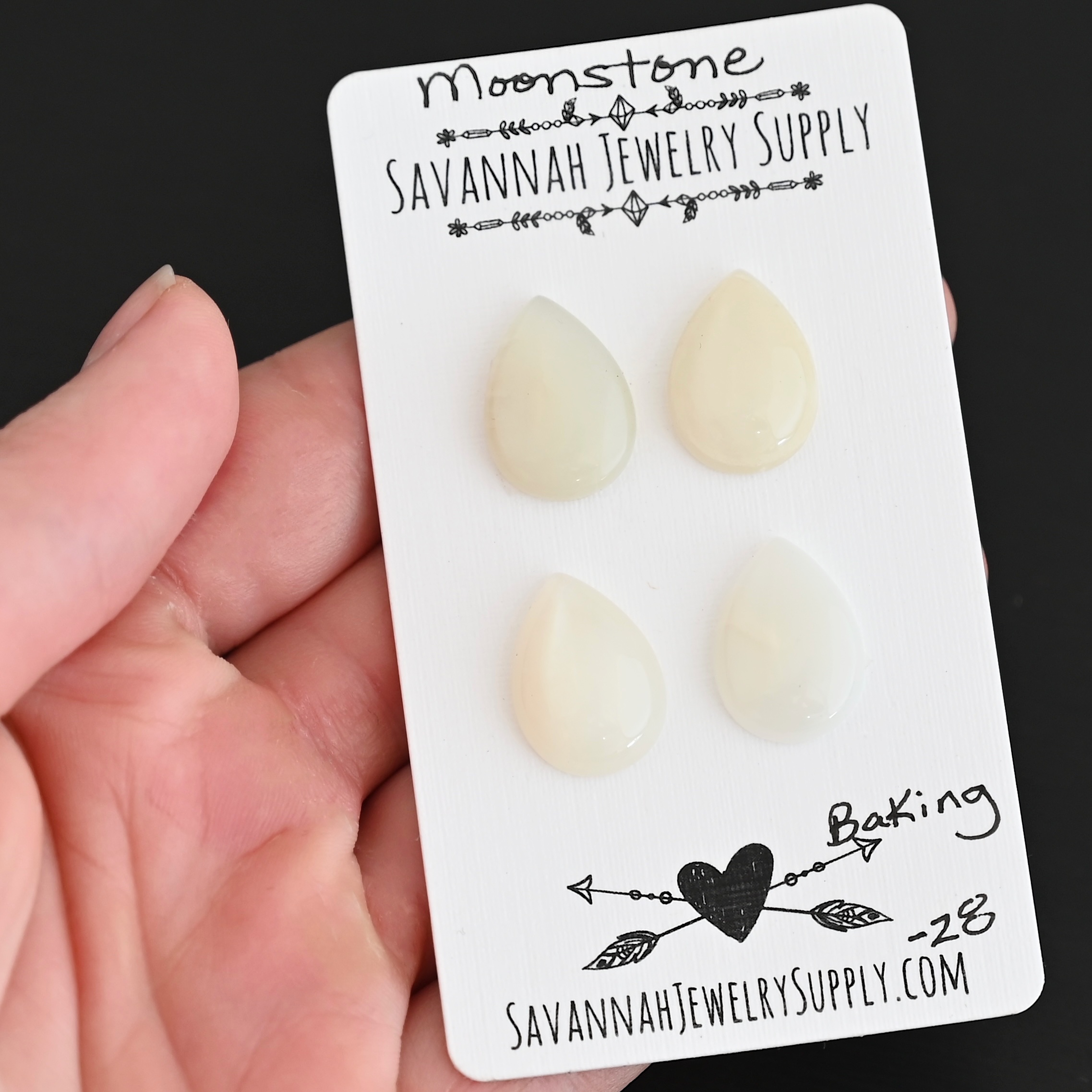 Baking Moonstone Cabochon Parcel shown in hand