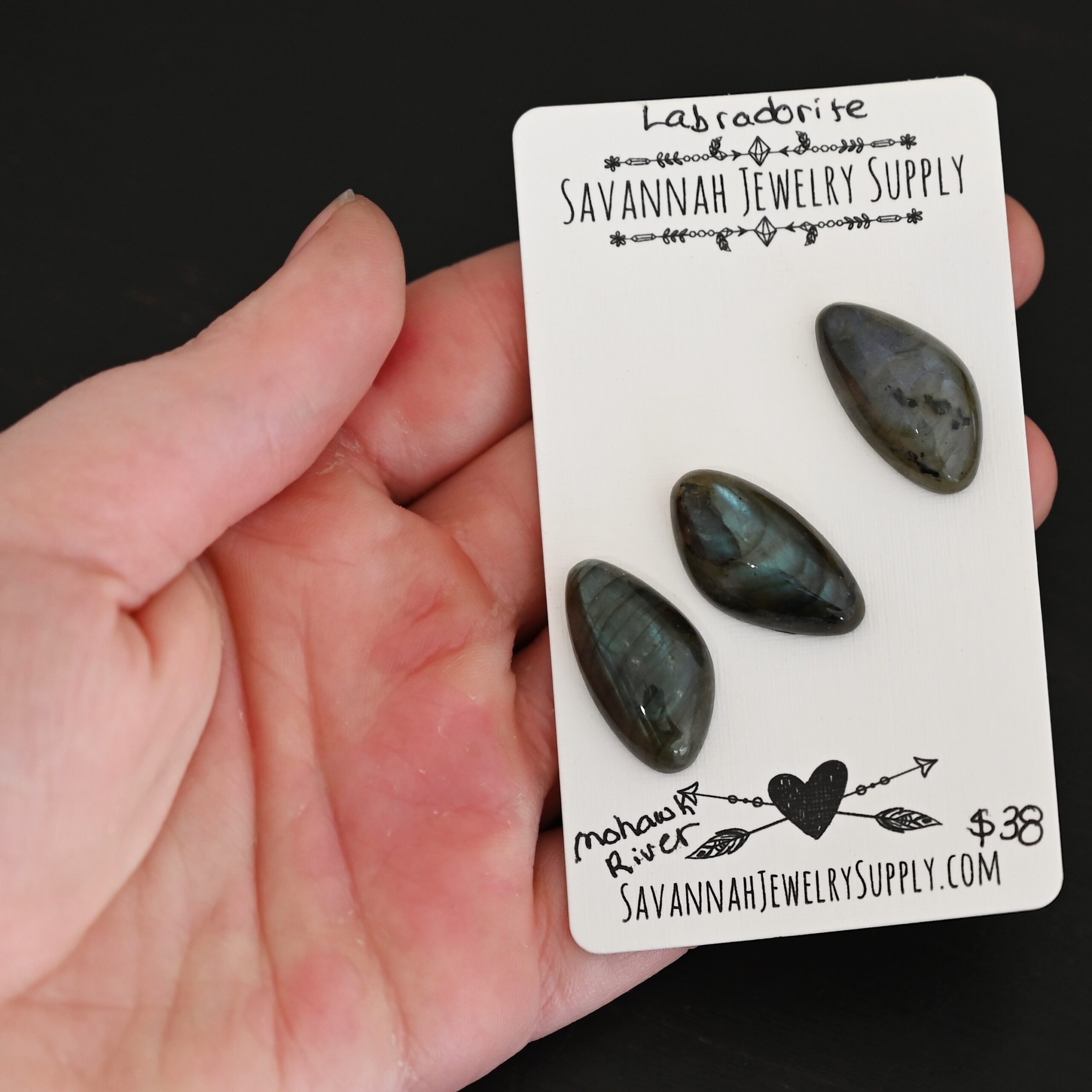 Mohawk River Labradorite Cabochon Parcel shown in hand