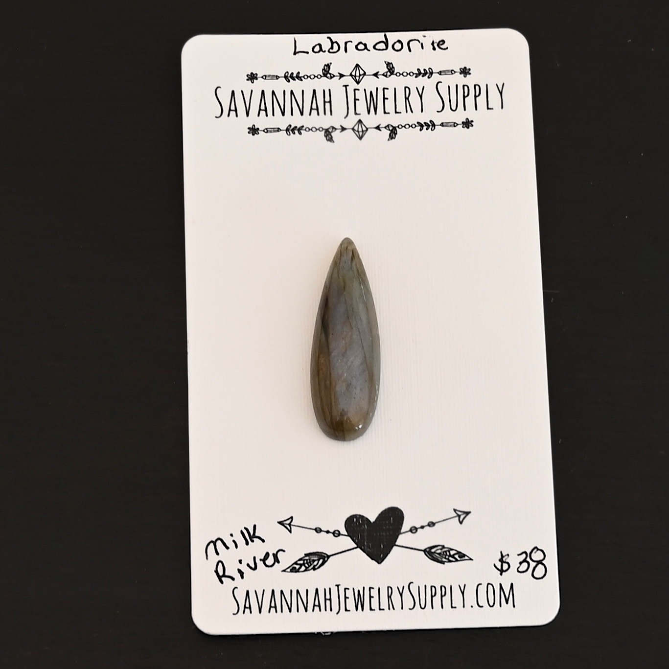Milk River Labradorite Cabochon Parcel shown on business card