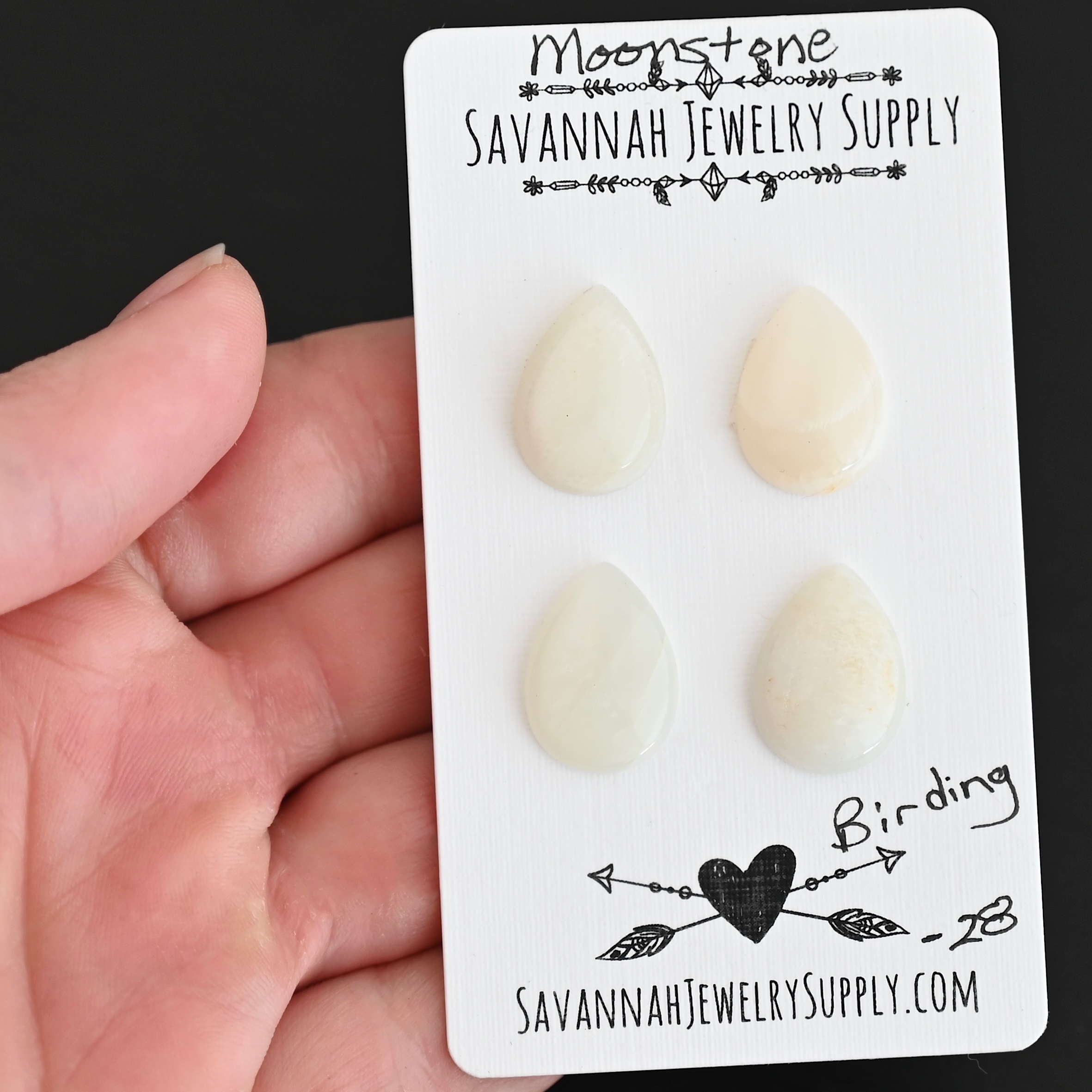 Birding Moonstone Cabochon Parcel shown in hand