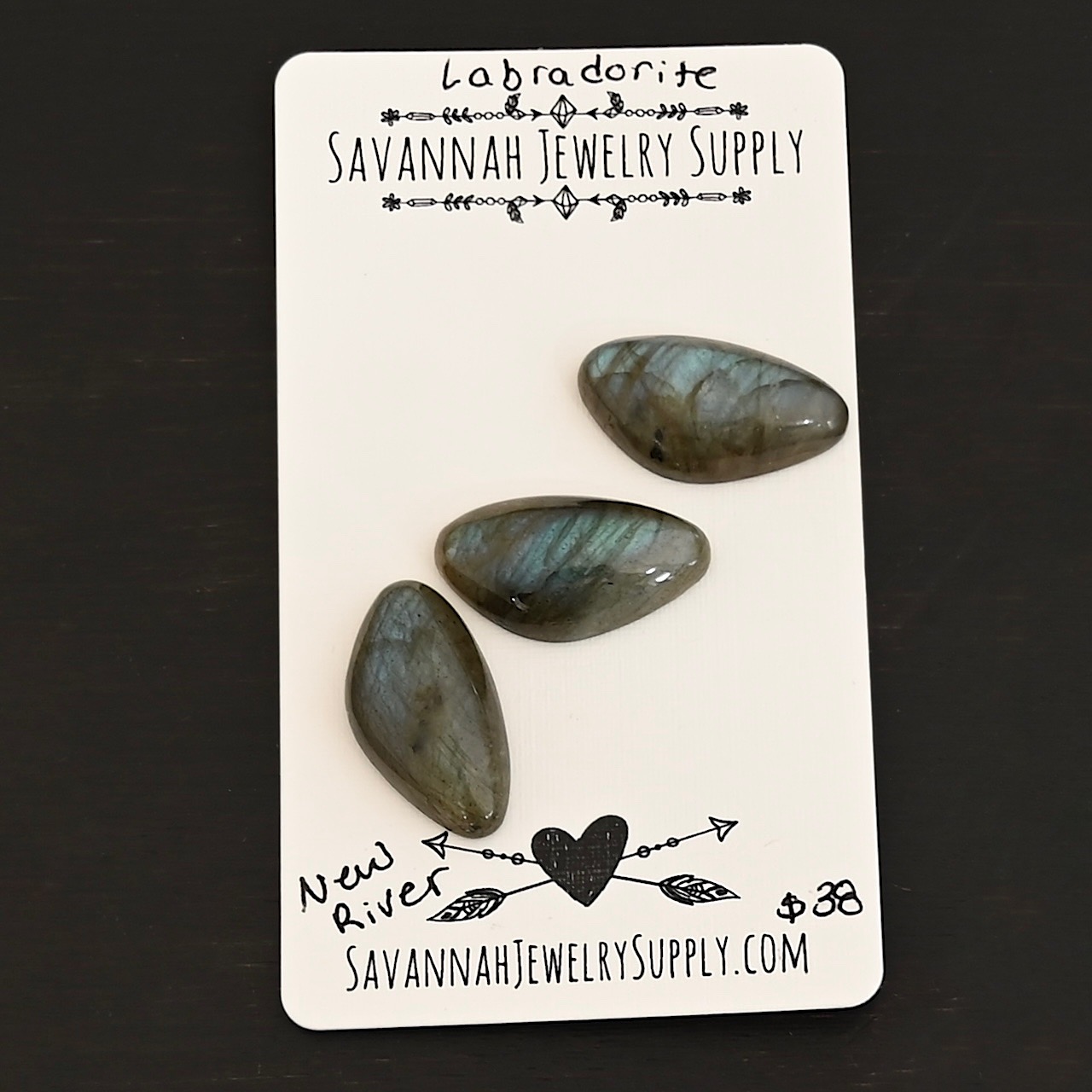 New River Labradorite Cabochon Parcel shown on business card