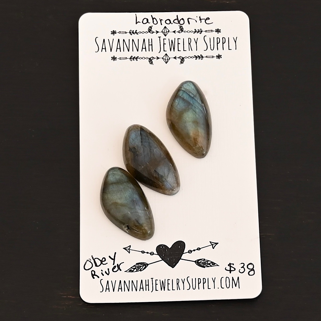 Obey River Labradorite Cabochon Parcel shown on business card