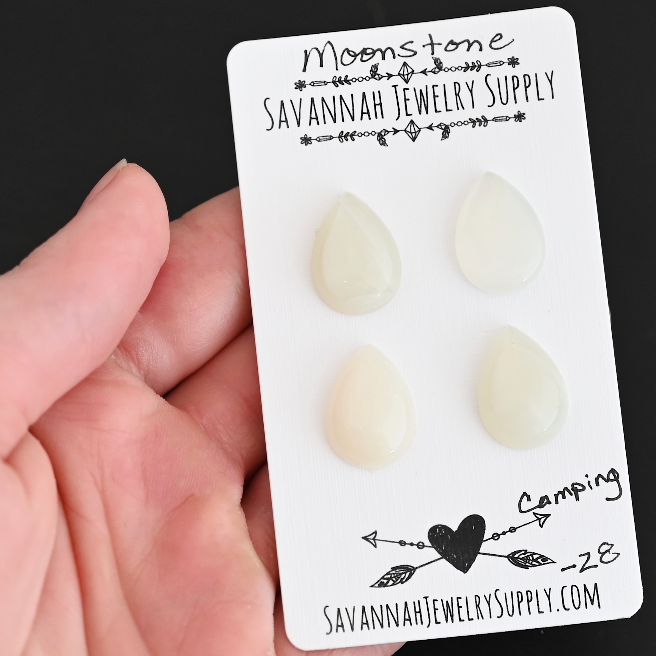 Camping Moonstone Cabochon Parcel shown in hand