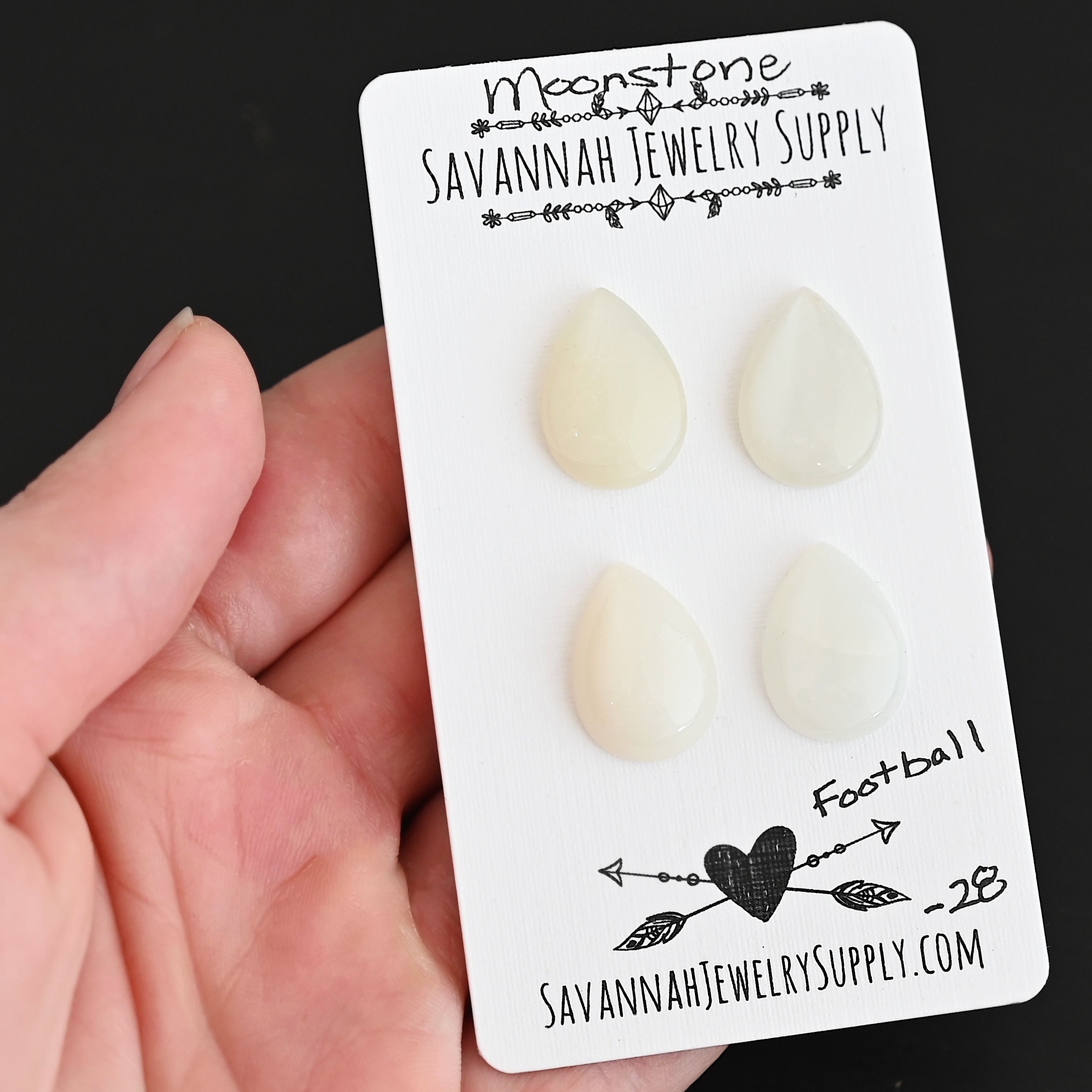 Football Moonstone Cabochon Parcel shown in hand