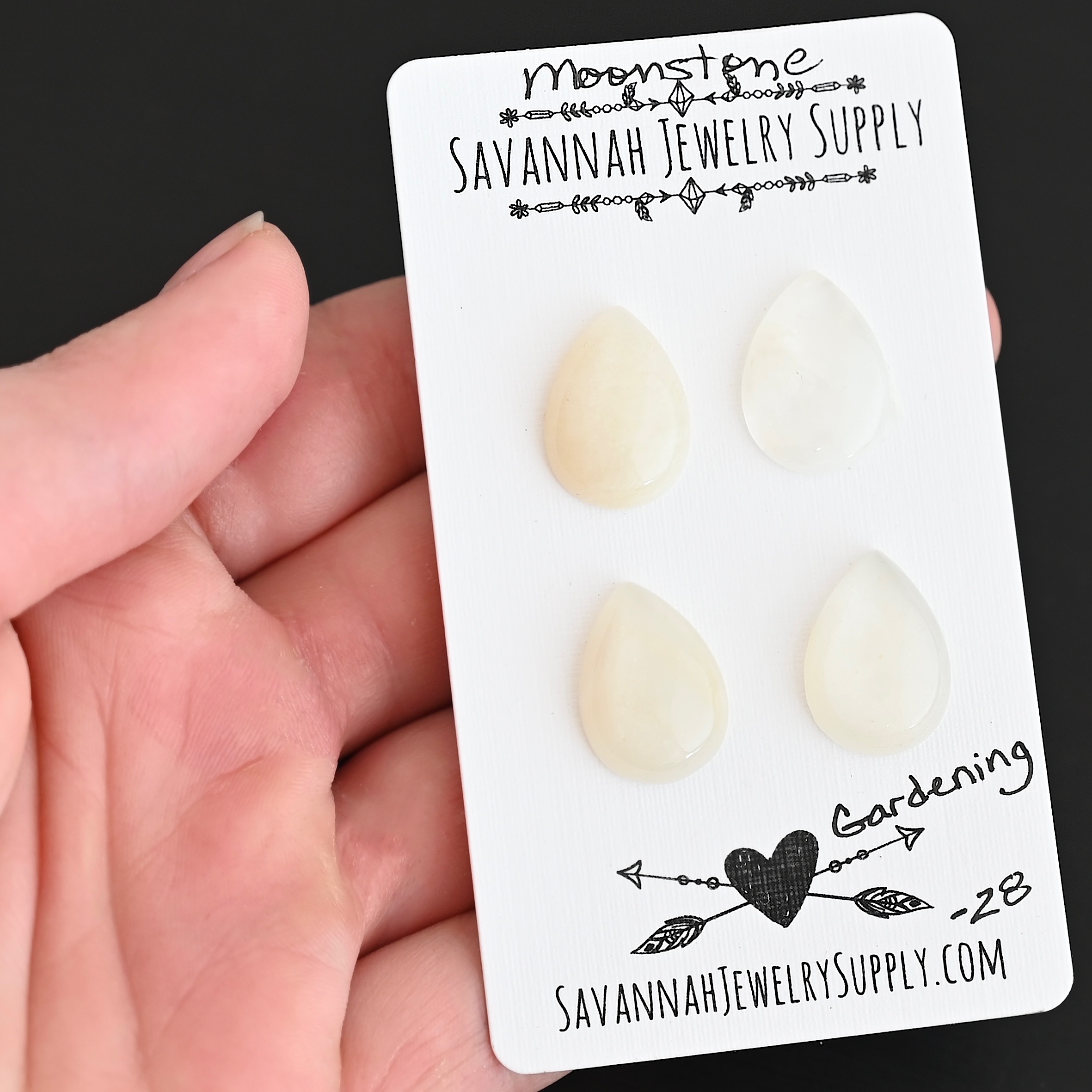 Gardening Moonstone Cabochon Parcel shown in hand