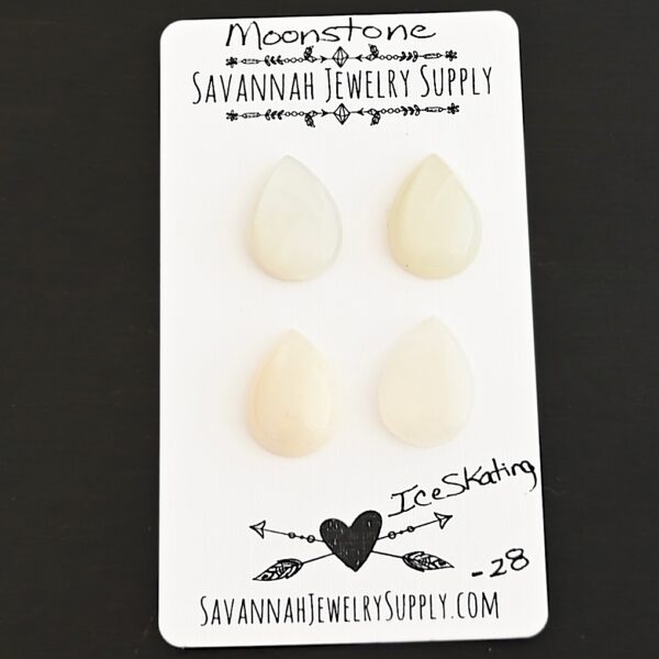 Ice Skating Moonstone Cabochon Parcel shown on business card