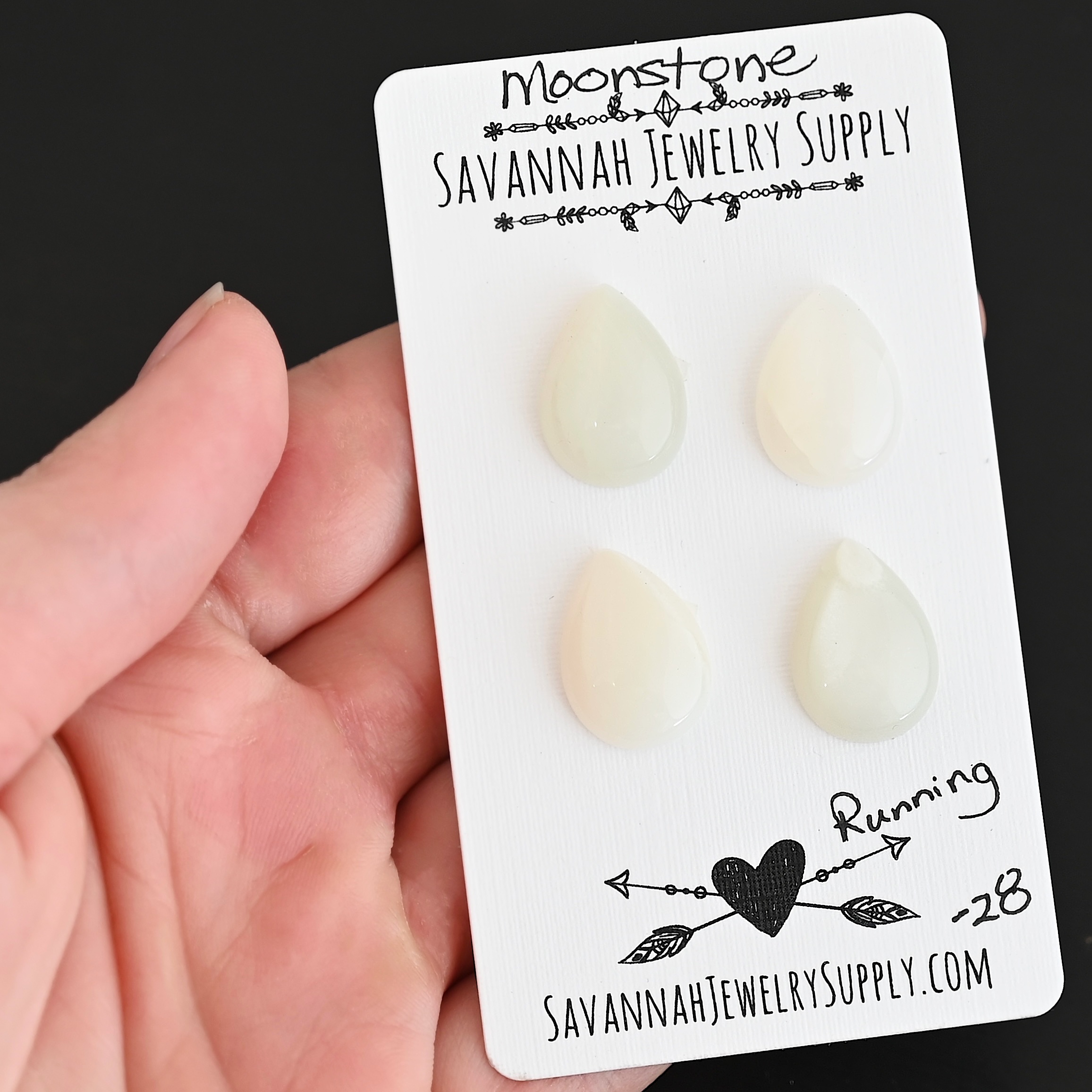 Running Moonstone Cabochon Parcel shown in hand