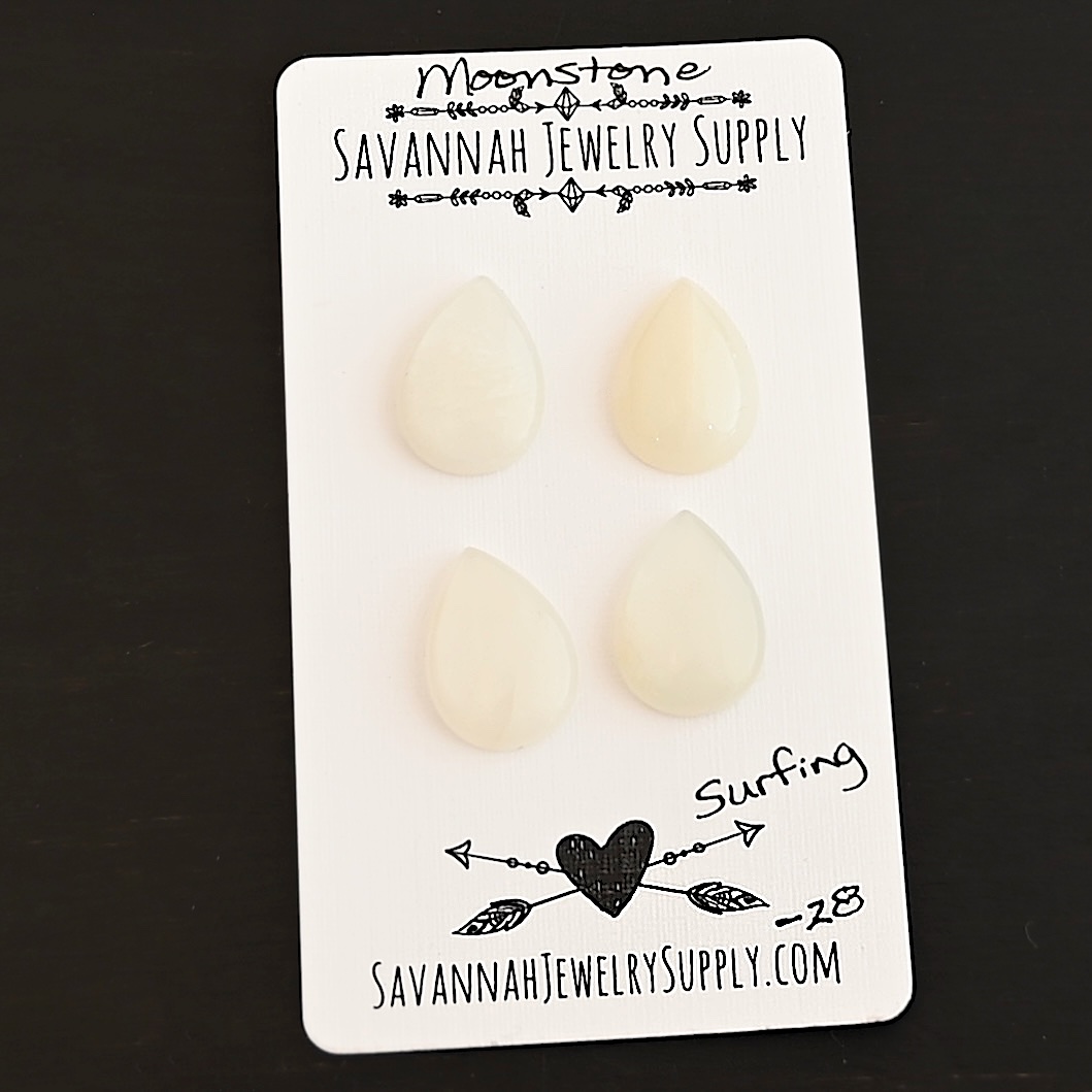 Surfing Moonstone Cabochon Parcel shown on business card