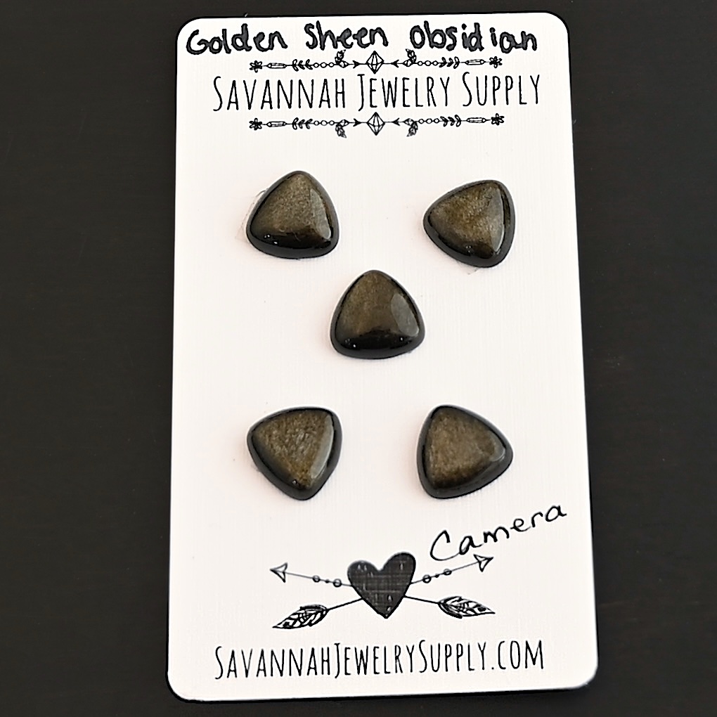 Camera Golden Sheen Obsidian Cabochon Parcel shown on business card