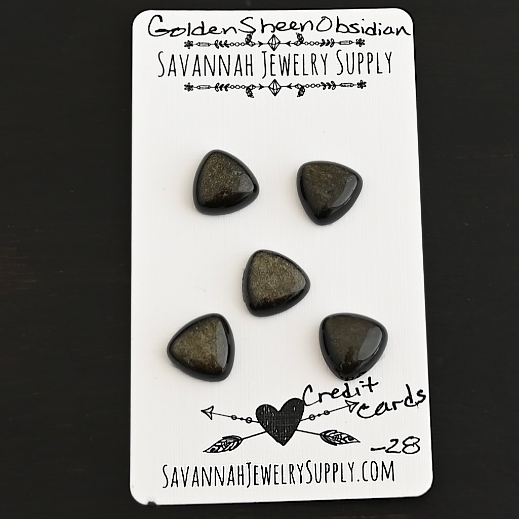 Credit Cards Golden Sheen Obsidian Cabochon Parcel shown on business card