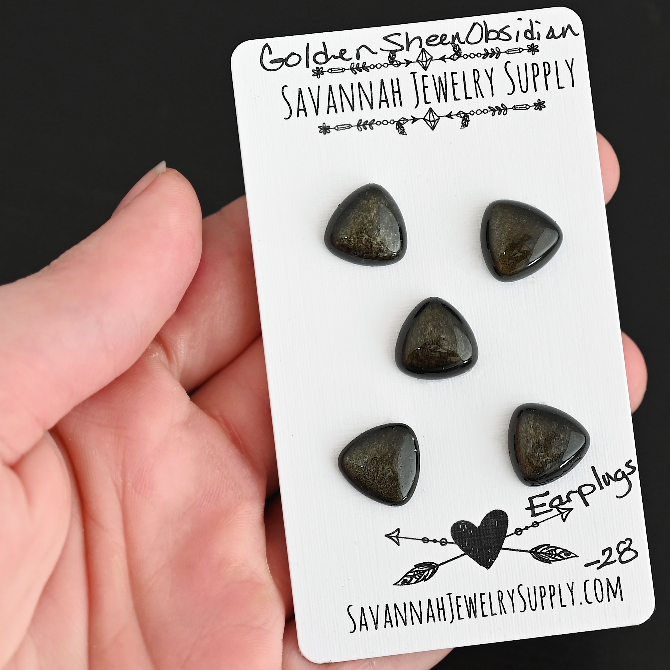 Earplugs Golden Sheen Obsidian Cabochon Parcel shown in hand