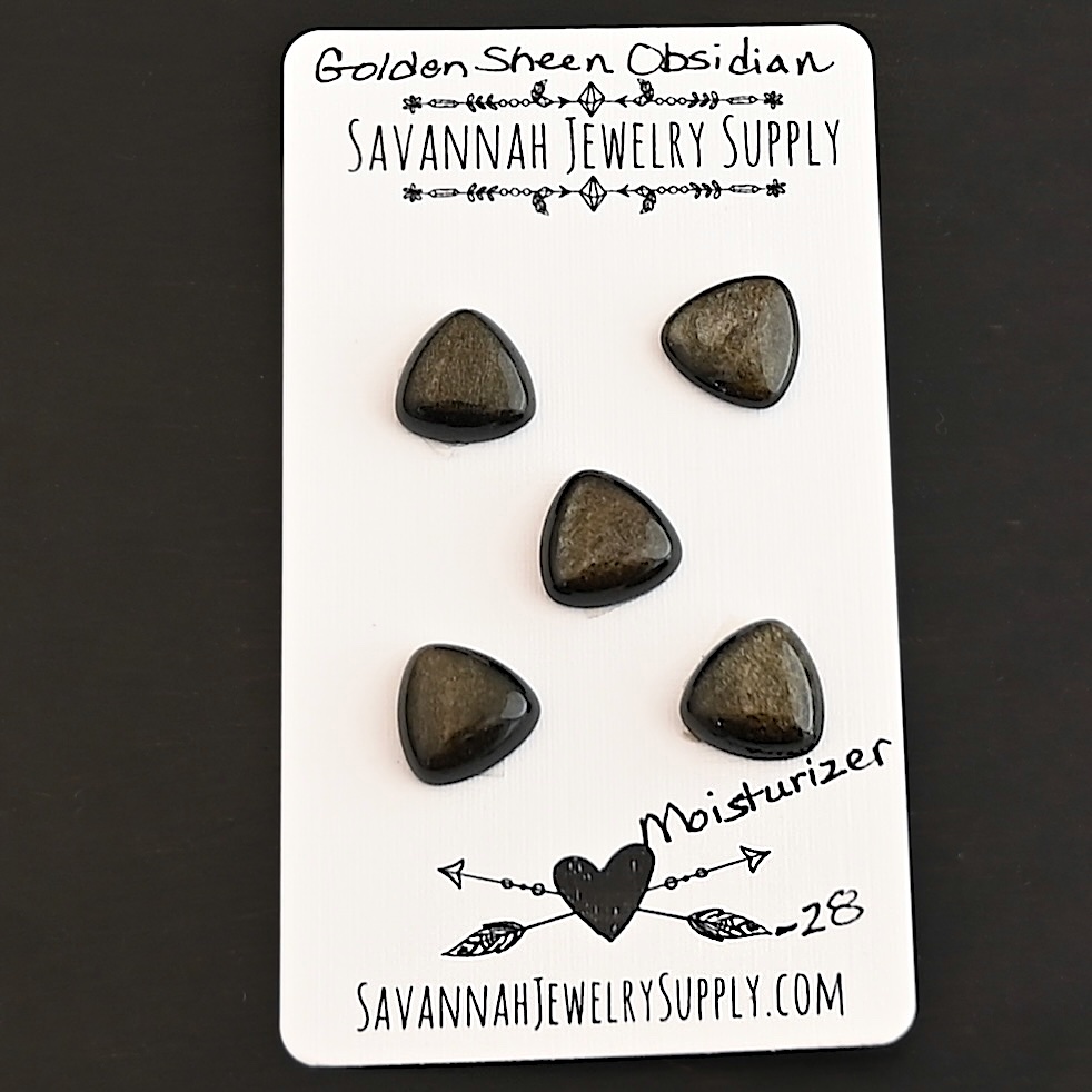 Moisturizer Golden Sheen Obsidian Cabochon Parcel shown on business card