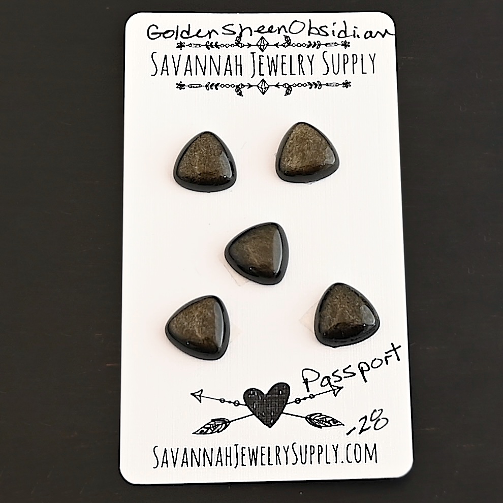 Passport Golden Sheen Obsidian Cabochon Parcel shown on business card