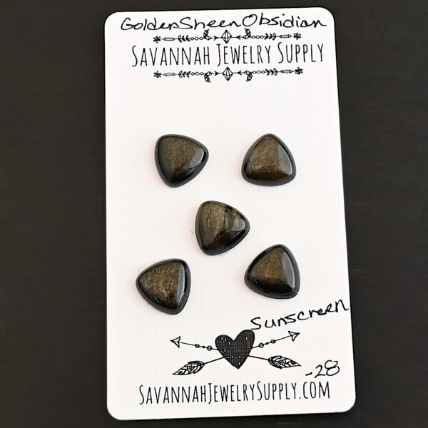 Sunscreen Golden Sheen Obsidian Cabochon Parcel shown on business card