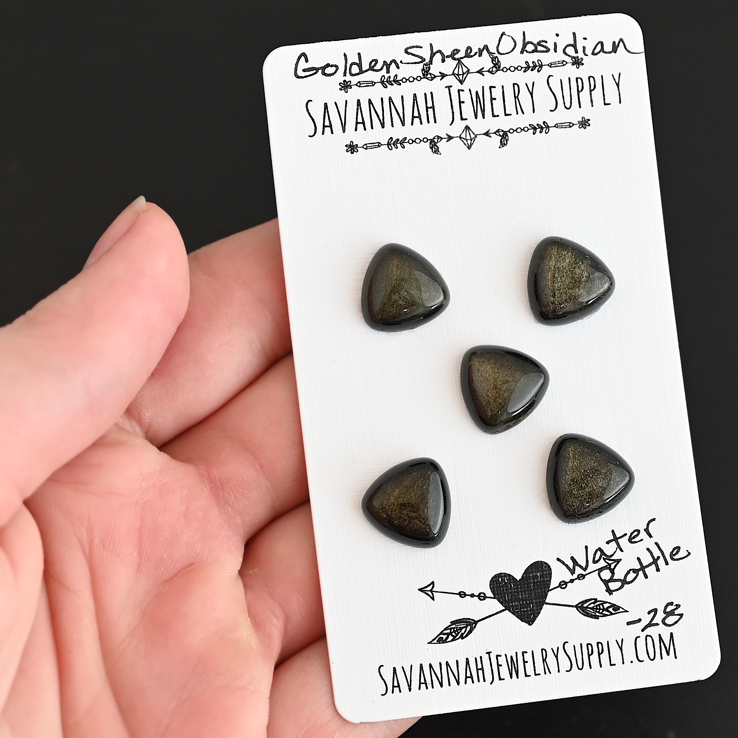 Water Bottle Golden Sheen Obsidian Cabochon Parcel shown in hand