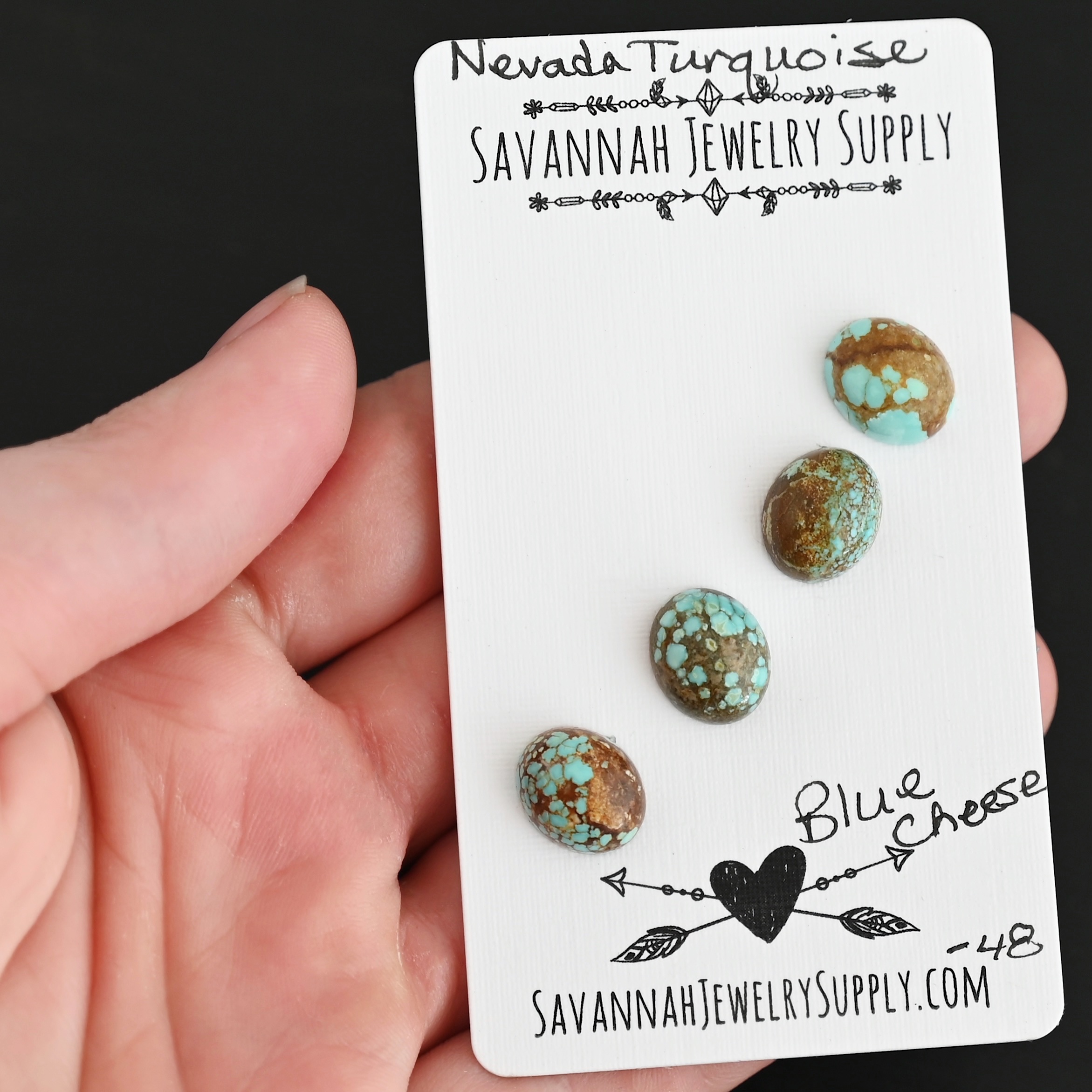 Blue Cheese Turquoise Cabochon Parcel shown in hand