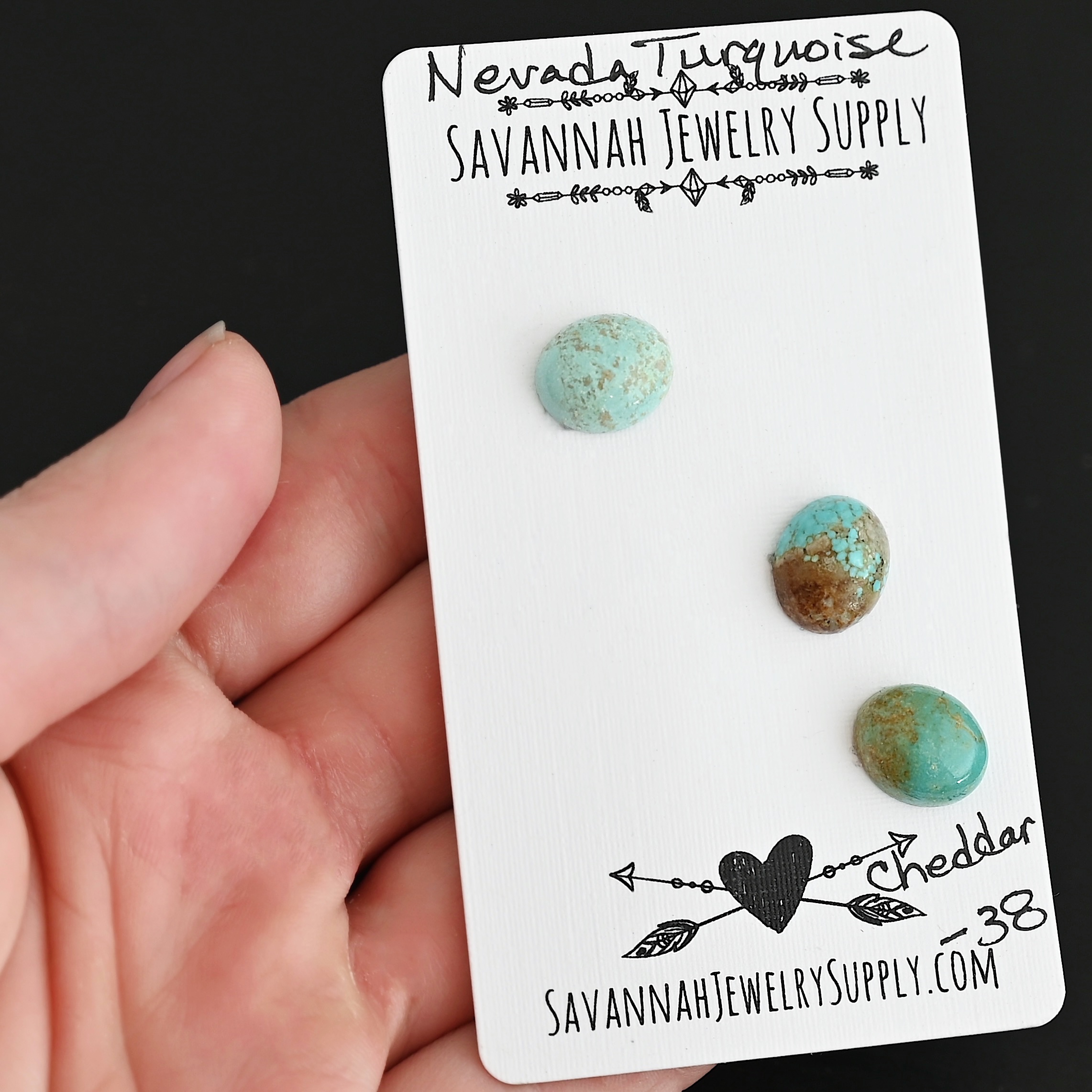 Cheddar Turquoise Cabochon Parcel shown in hand