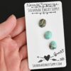 Goat Turquoise Cabochon Parcel shown in hand