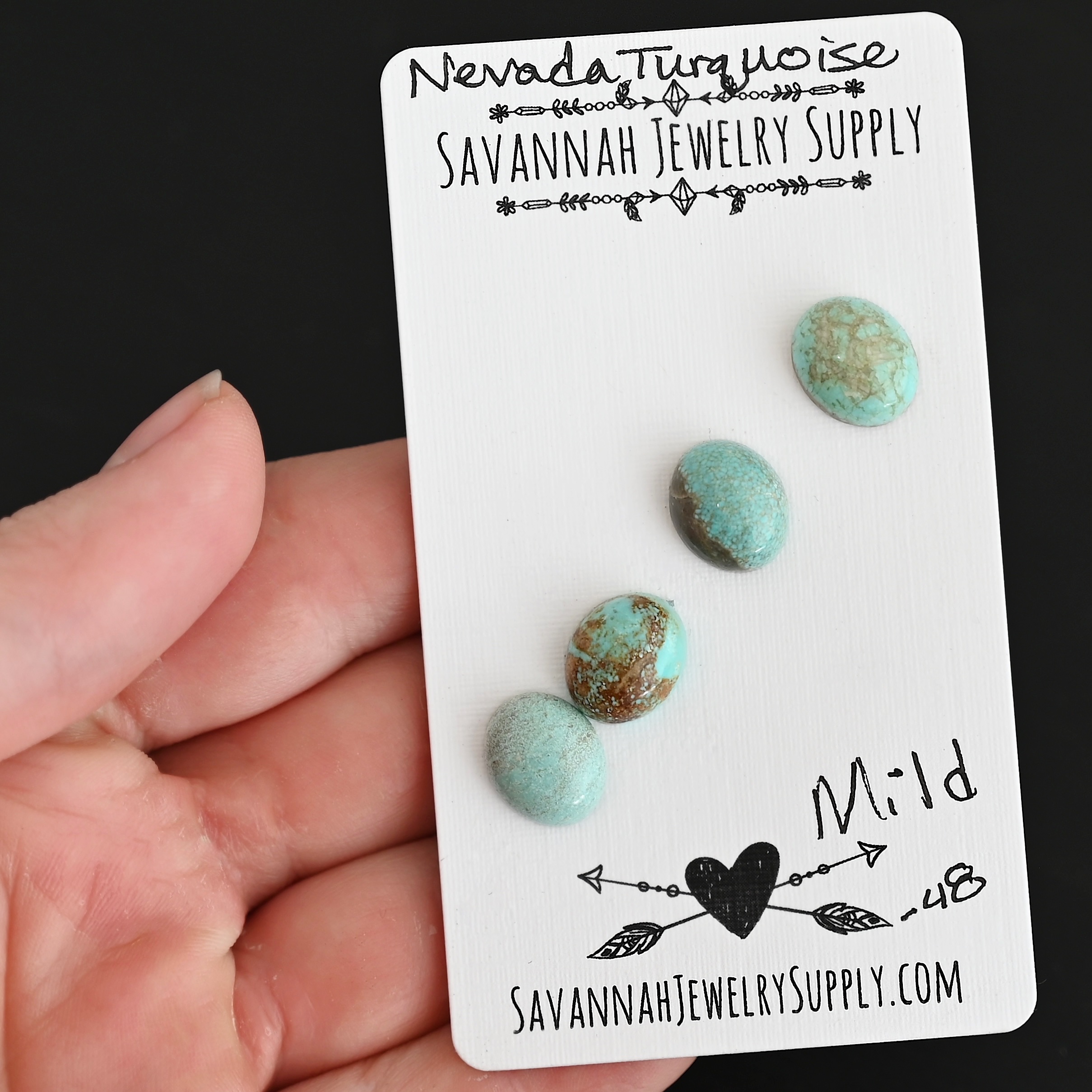 Mild Turquoise Cabochon Parcel shown in hand